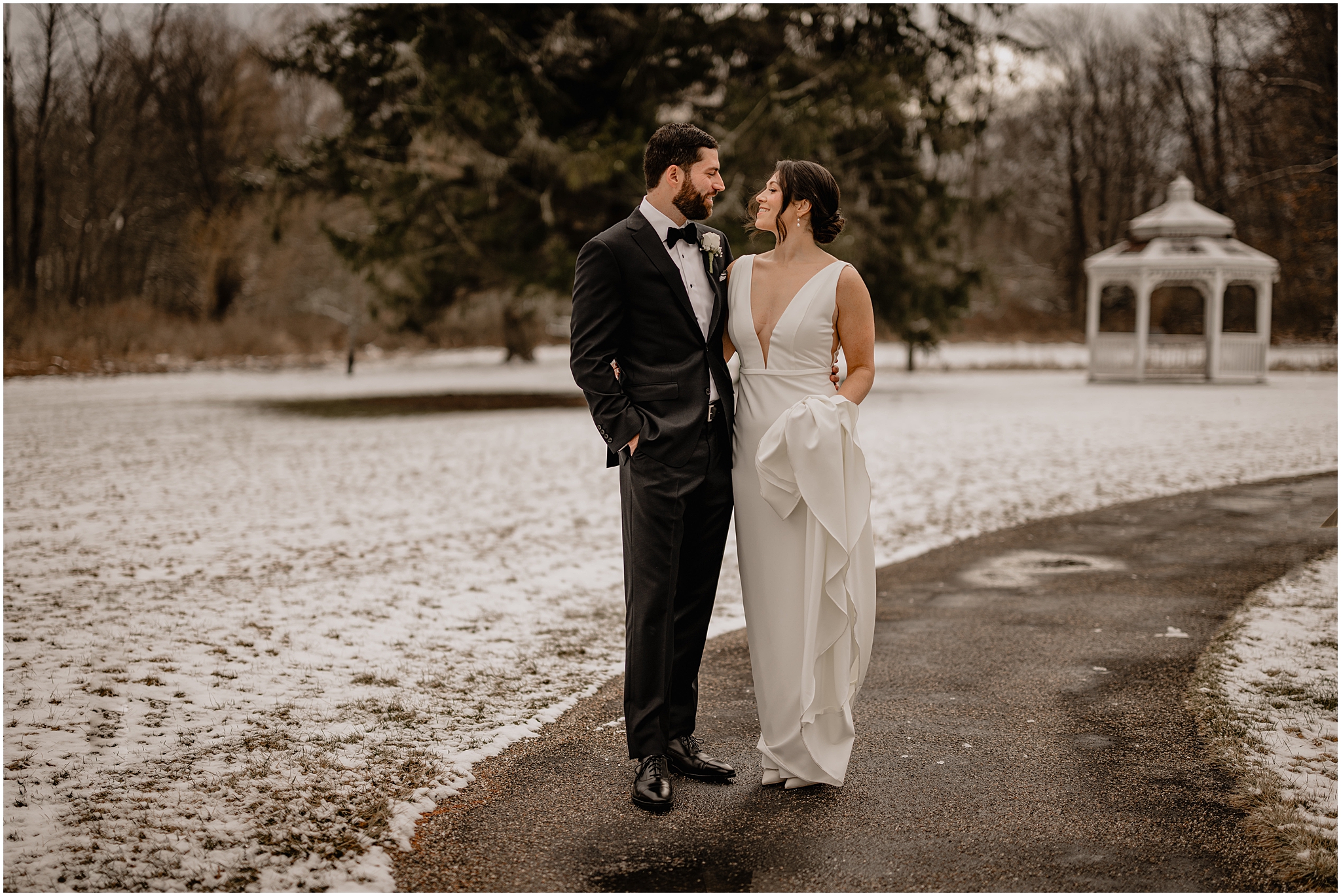 Couple before their winter wedding at The Barn at Perona Farms.