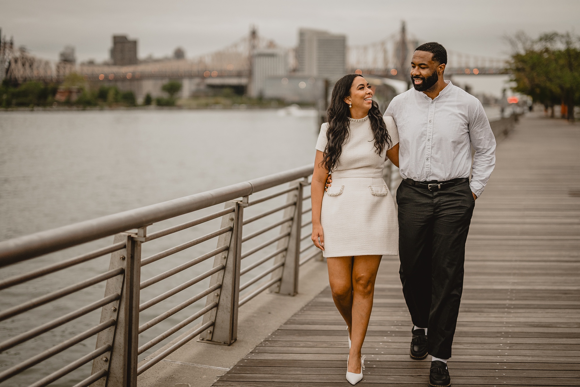 man and woman walk on wooden pathway inside Gantry State Park Plaza