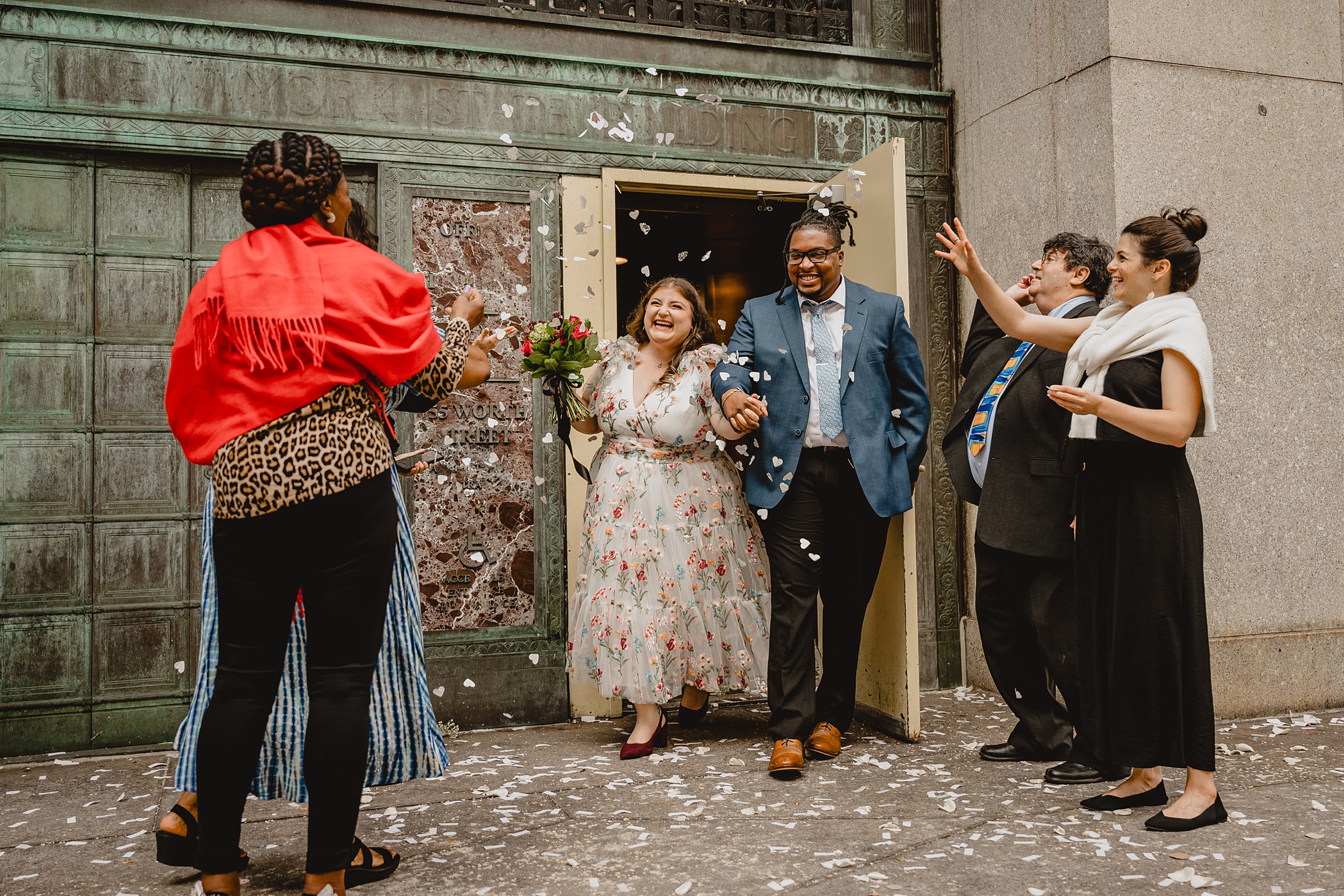 bride and groom leave NYC City Hall