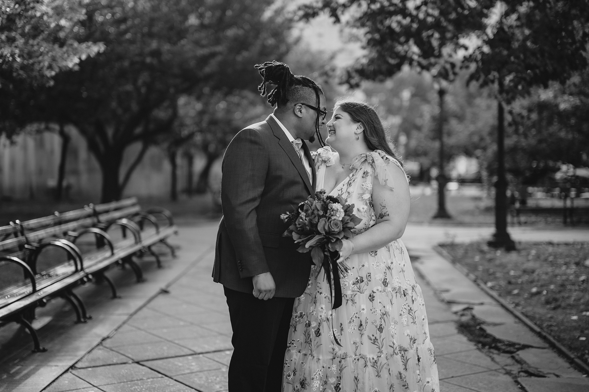 newlyweds smile inside NYC Park during elopement portraits