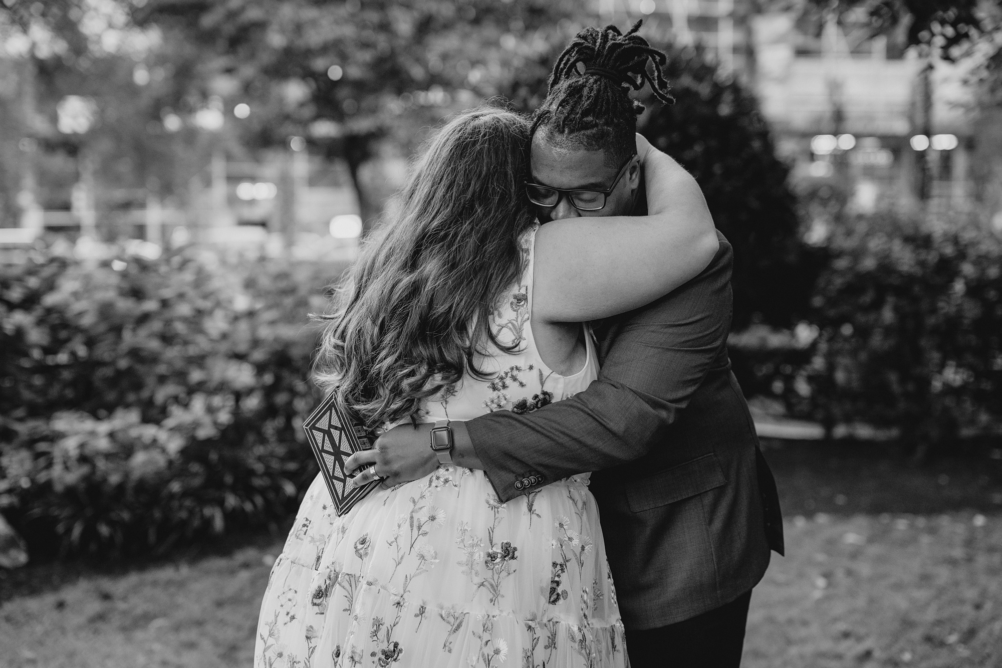 newlyweds hug during portraits in NYC park
