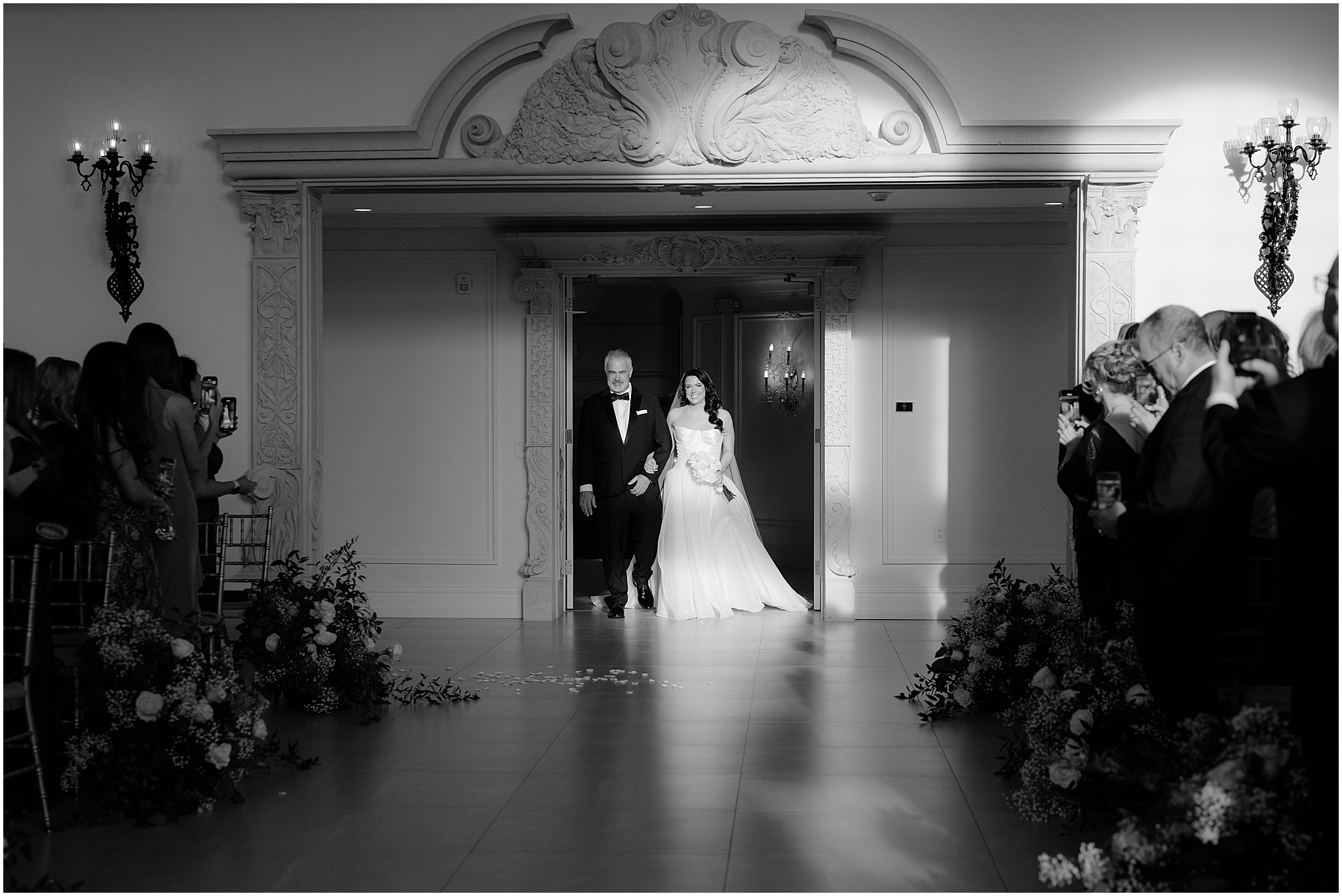 father escorts bride into wedding reception in ballroom at the Estate at Florentine Gardens