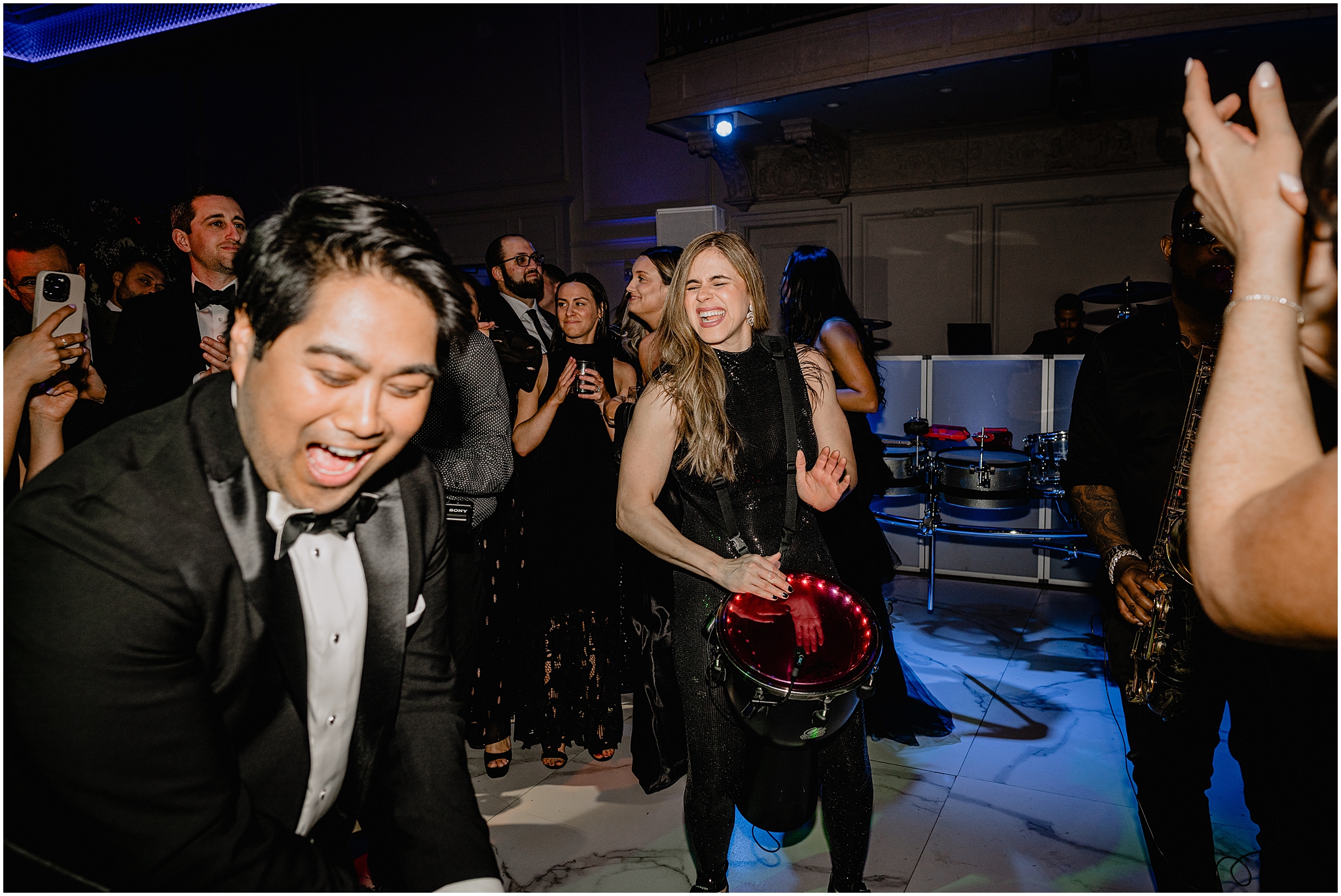 singer performs on dance floor with drum during River Vale NJ wedding reception