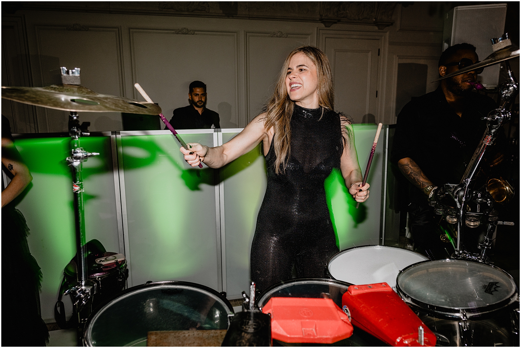 woman in black dress performs on drums during River Vale NJ wedding reception
