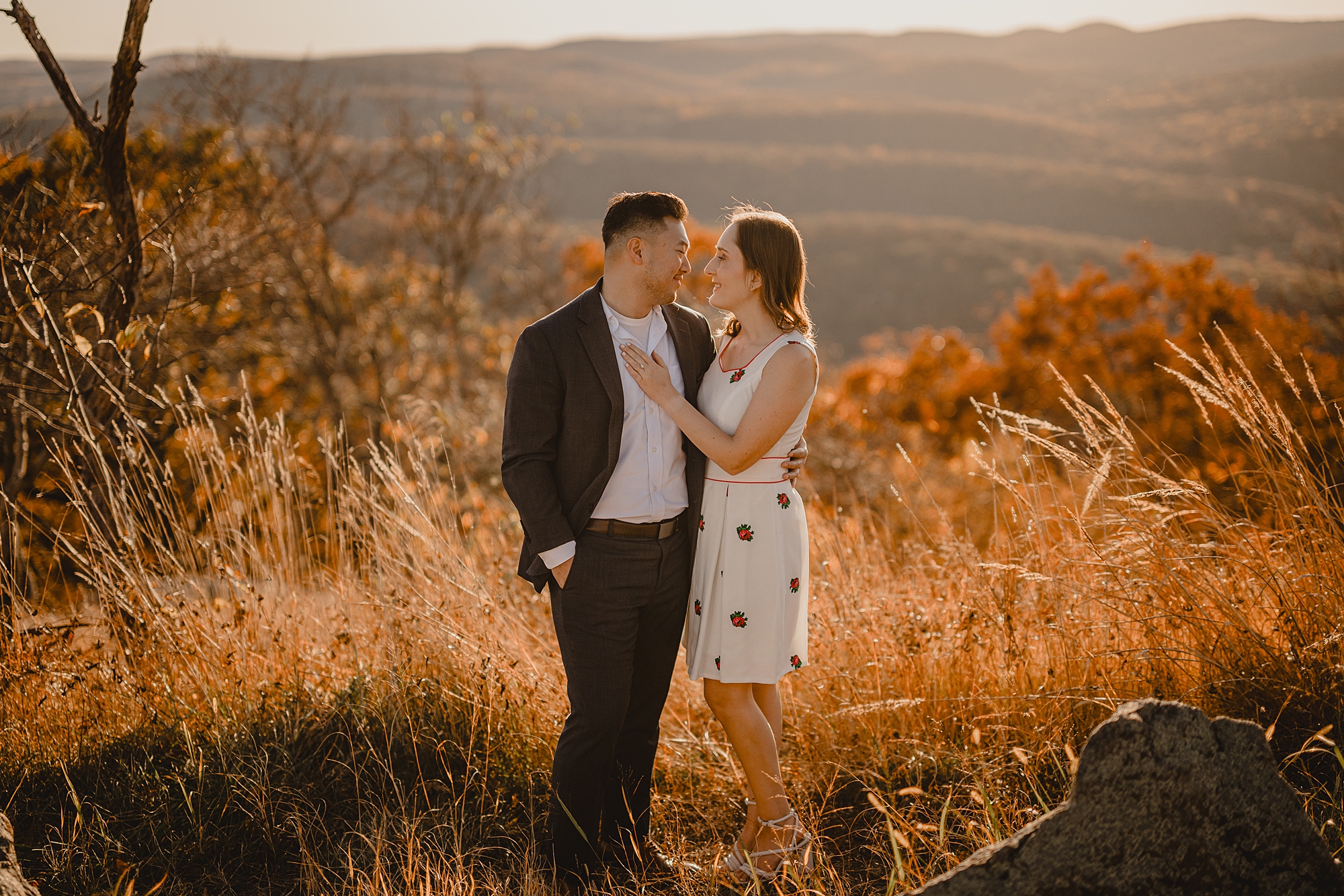 couple hugs on top of Bear Mountain in the Hudson Valley