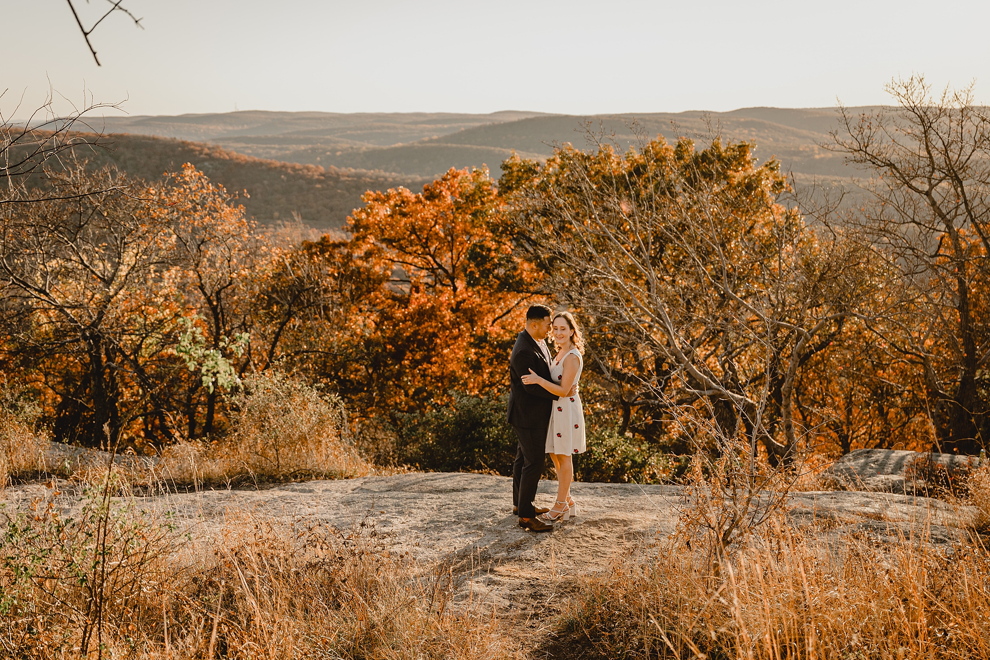 man and woman kiss on top of Bear Mountain in the Hudson Valley