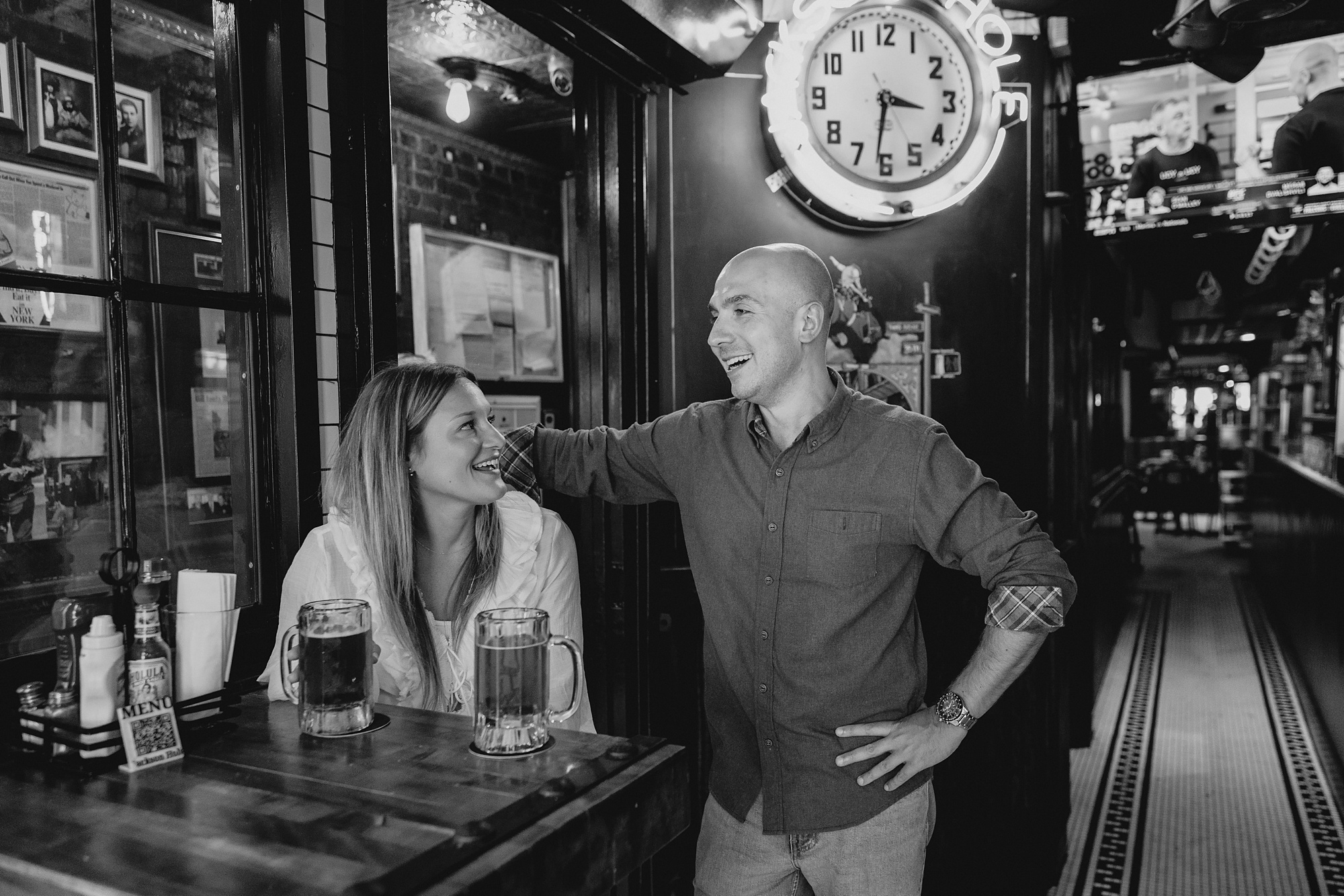 man looks at woman talking to her in Jackson Hole bar
