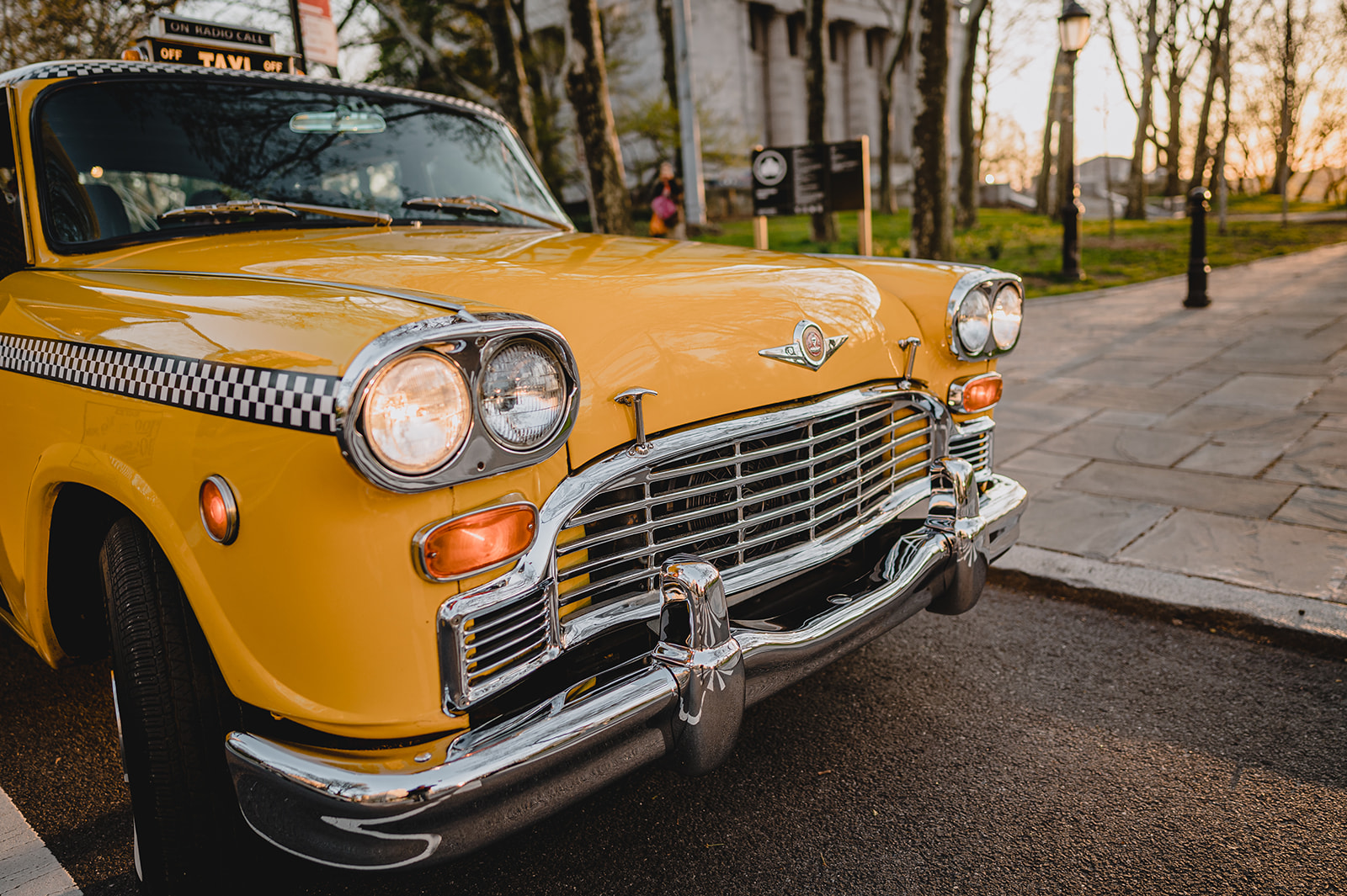 front of vintage taxi cab in New York City