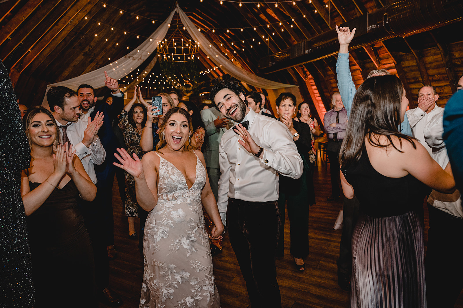 couple poses on dance floor in barn in New Jersey