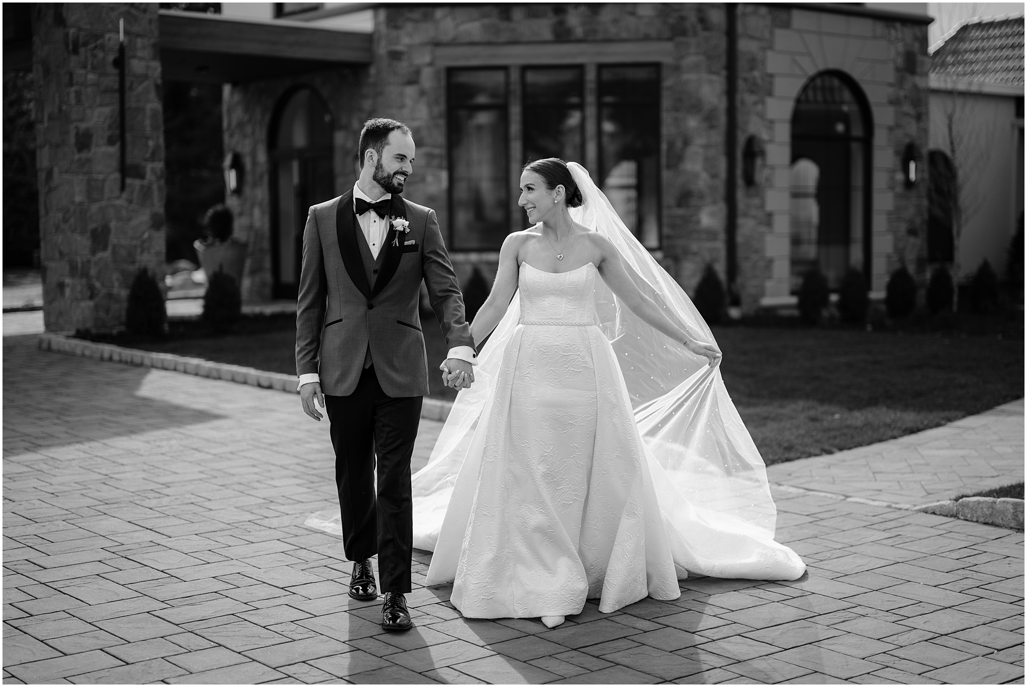 couple walking while holding hands at perona farms