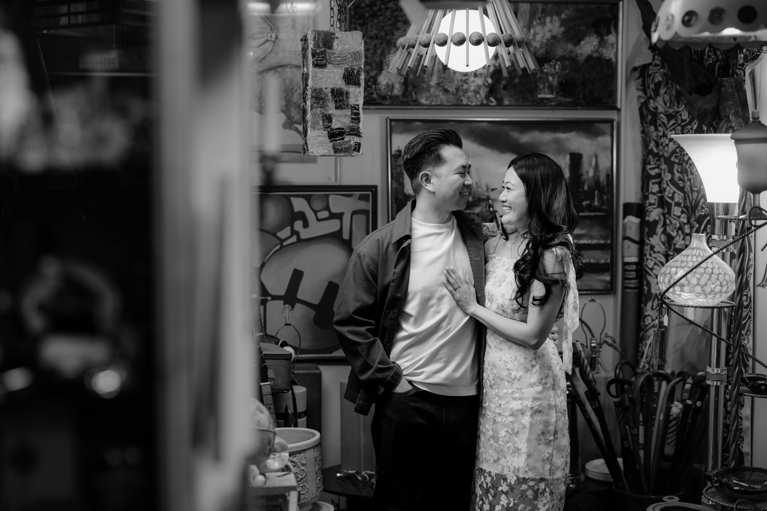 couple smiling at each other at the antique shop