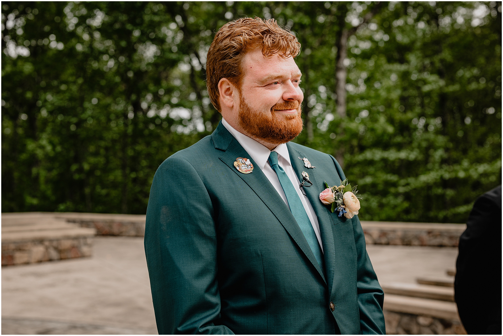 Groom waiting at the end of the aisle