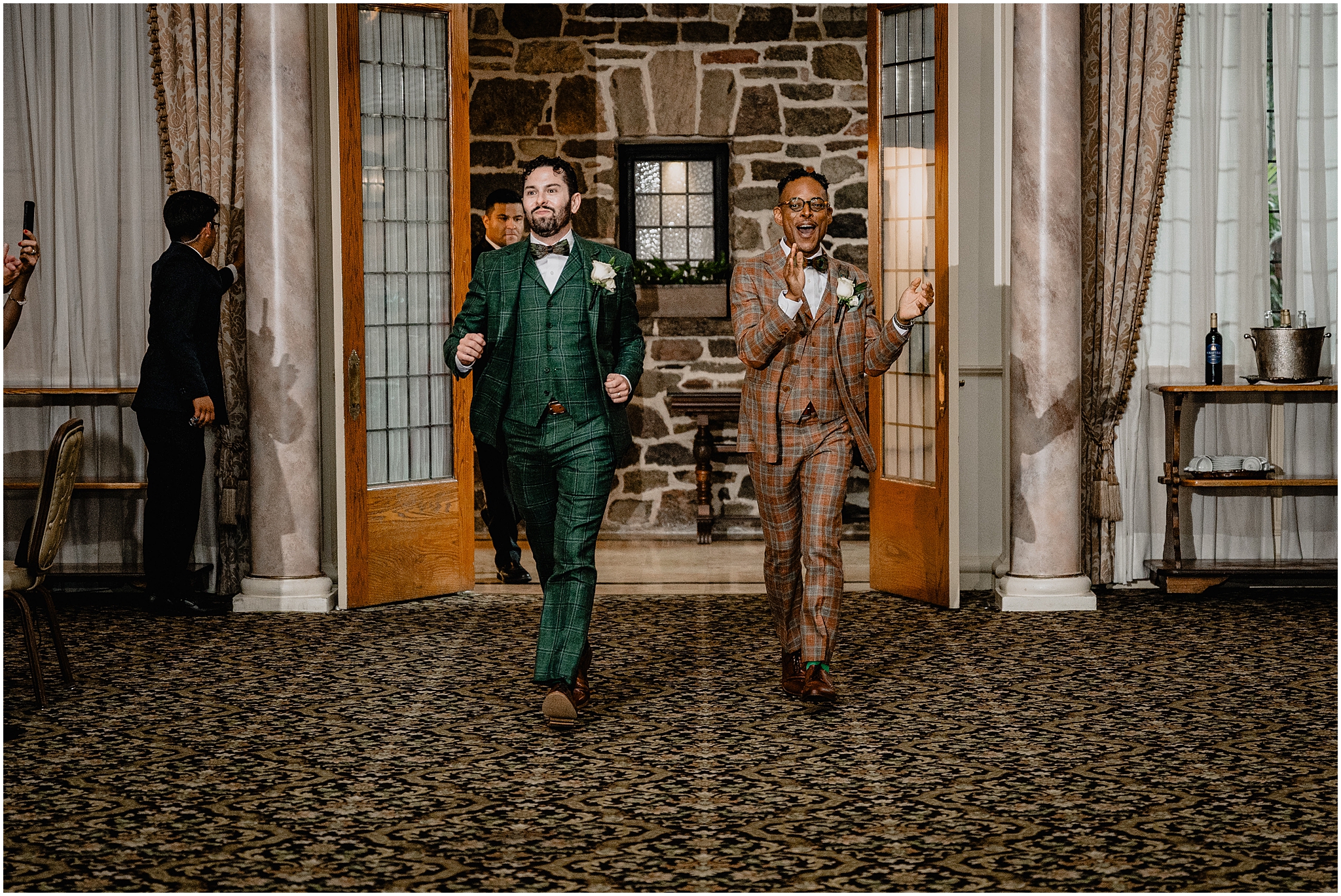 Couple’s grand entrance at their Joyful Pleasantdale Chateau Wedding, filled with energy and excitement.