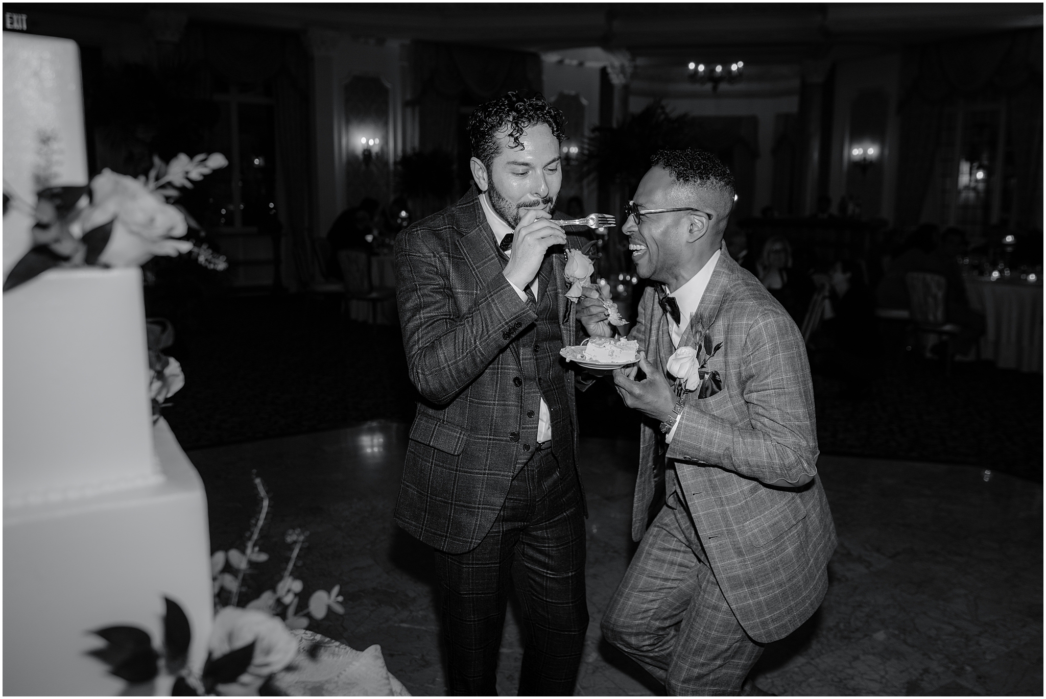 Couple sharing their cake-cutting moment during their Joyful Pleasantdale Chateau Wedding, capturing laughter and heartfelt joy.