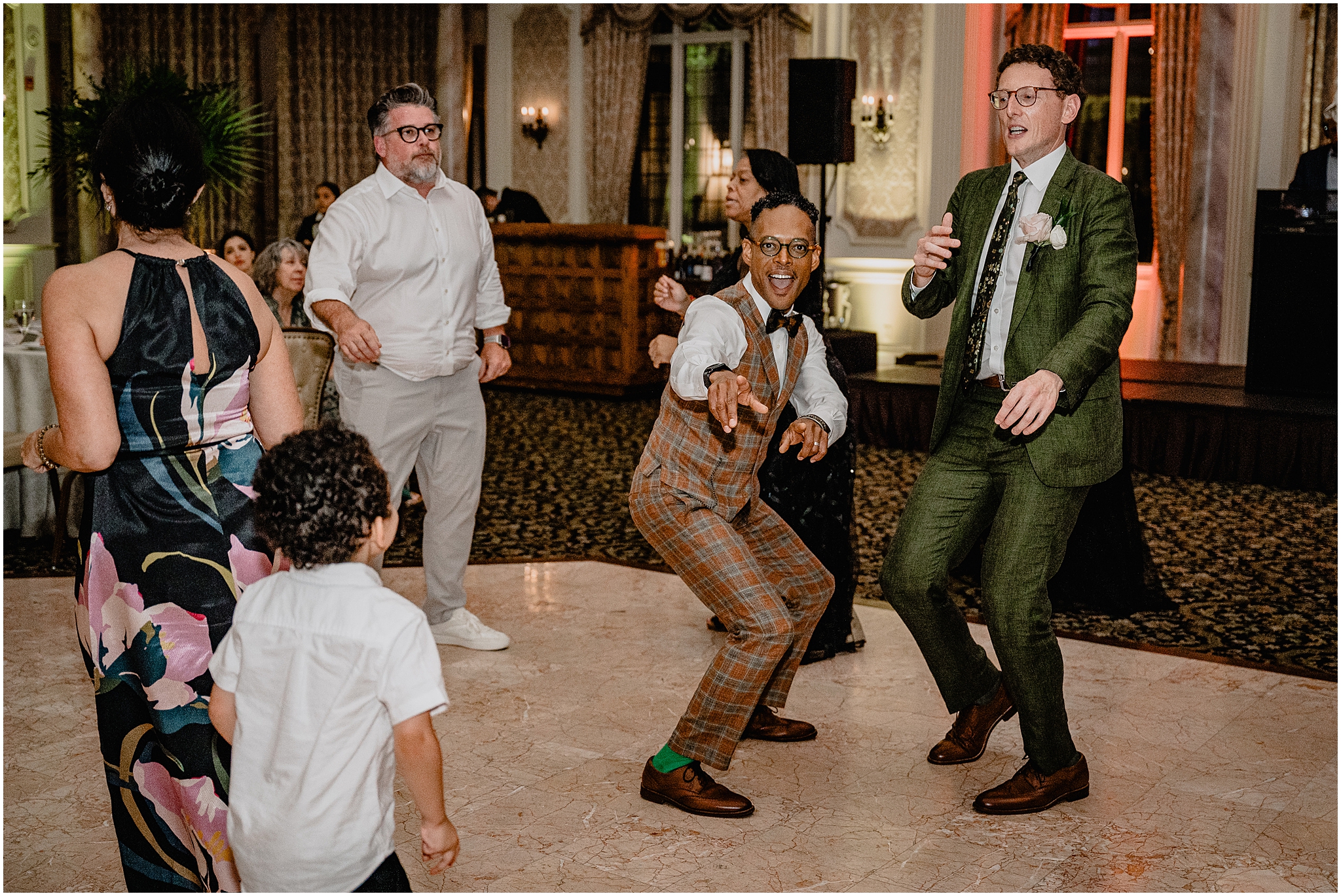 Couple dancing at their Joyful Pleasantdale Chateau Wedding, filled with energy, joy, and excitement.