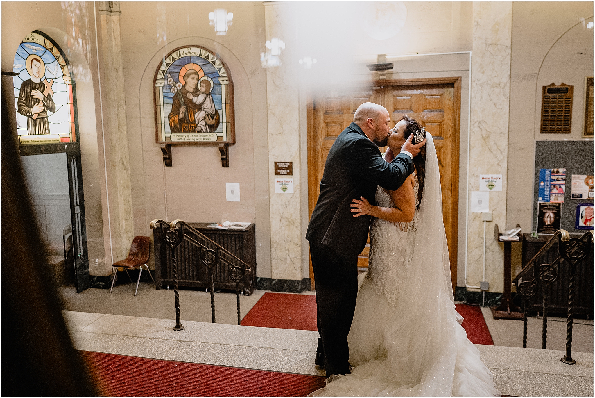 Couple sharing their first kiss during their Summer Park Chateau Wedding, marking the start of their married life.