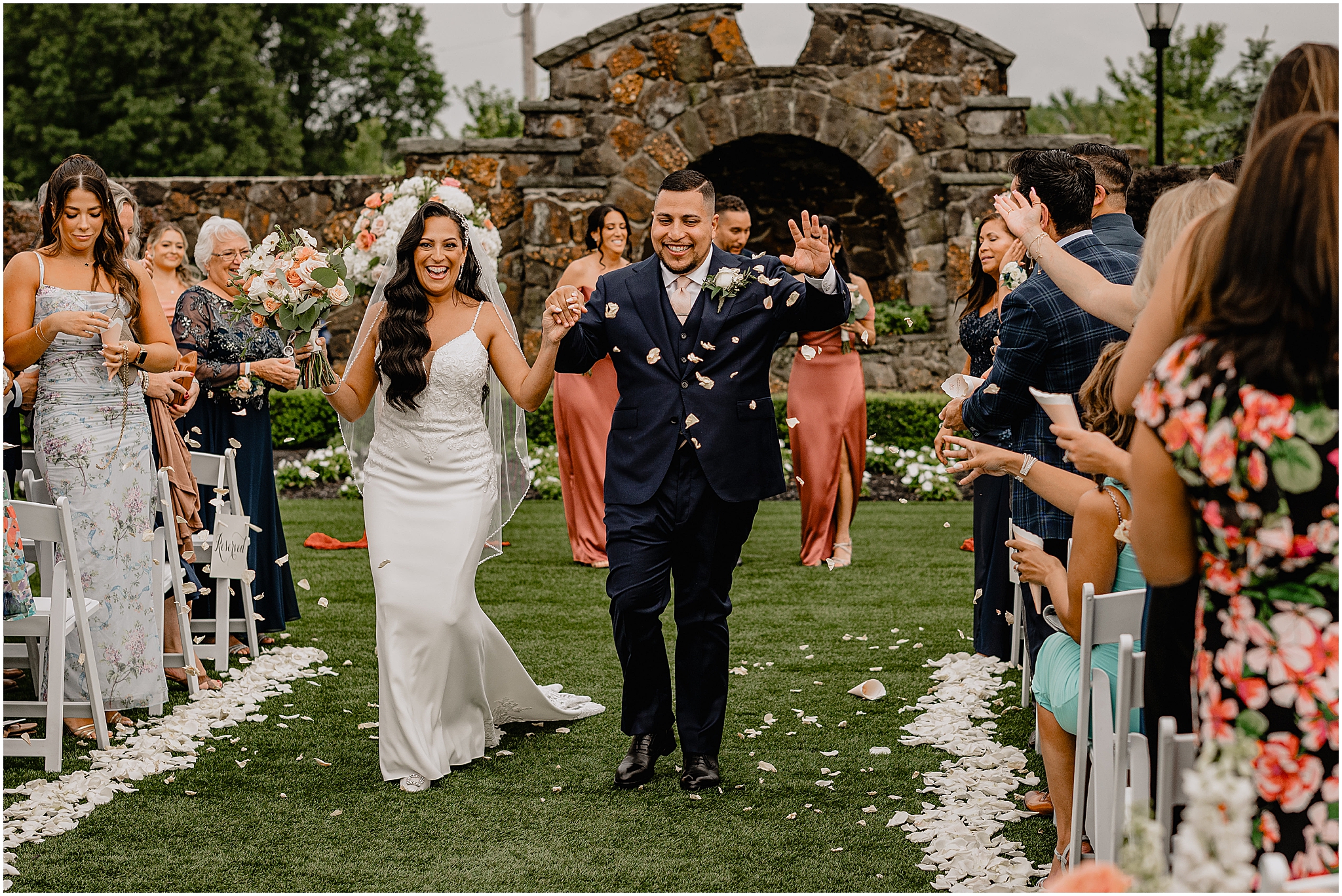 Bride and groom happily walking down the aisle after at their Wedding at the Tilling House in Eatontown, NJ