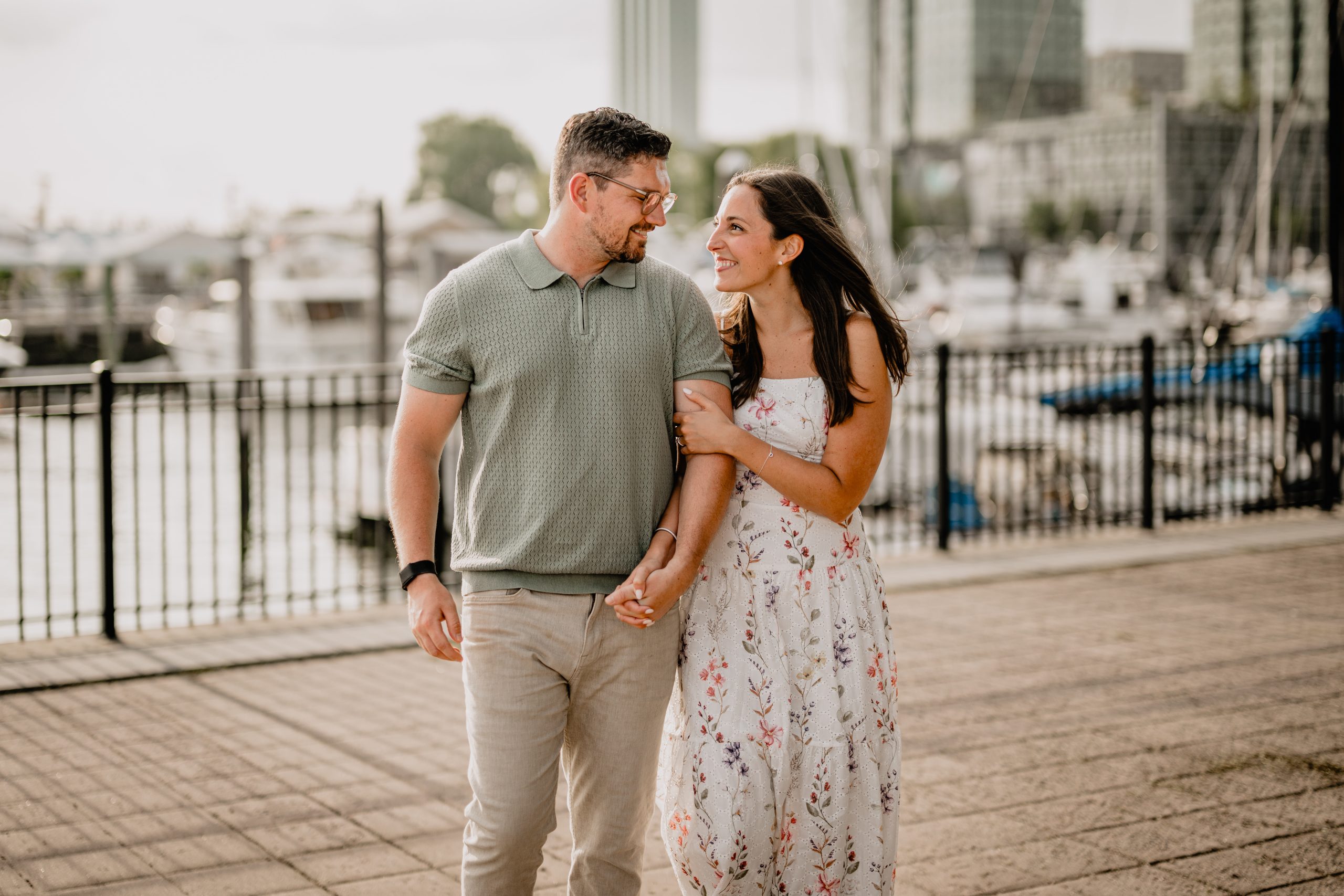 Couple smiling and showing their love during their Jersey City Engagement at Paulus Hook.