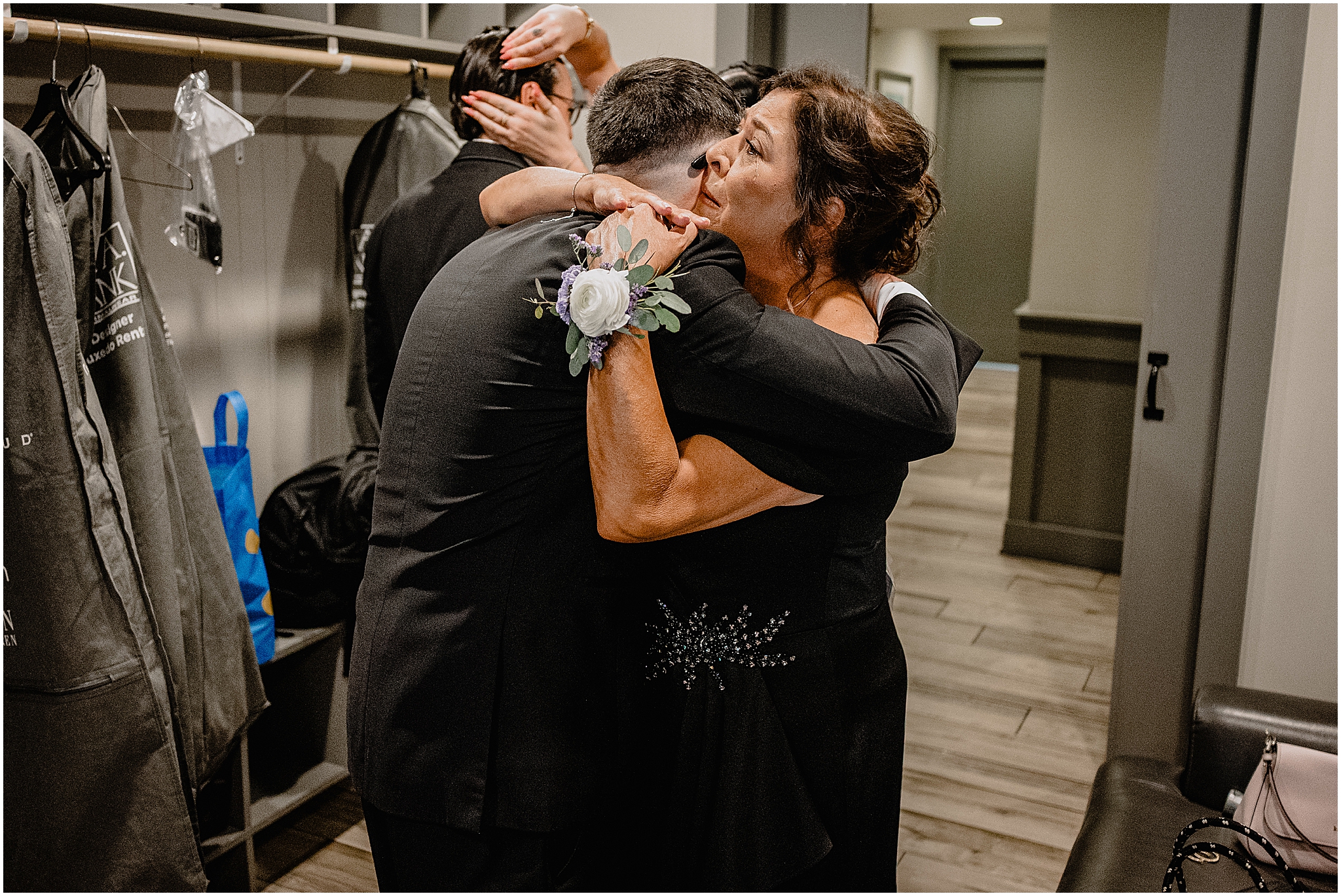 Groom hugging his loved ones before his wedding at Rock Island Lake Club.