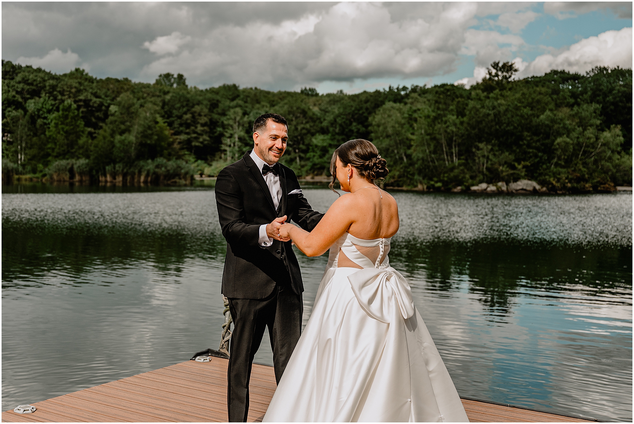 Couple’s first look and holding hands at their wedding at Rock Island Lake Club.