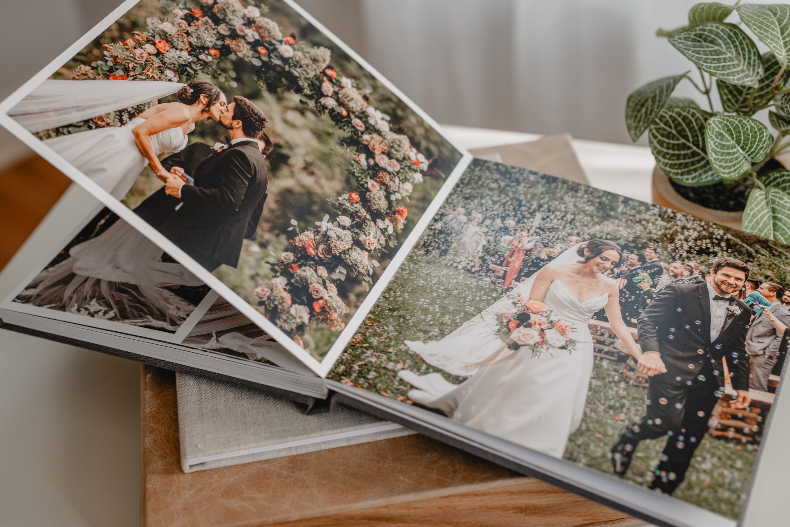 Wedding album featuring a couple’s first kiss and outdoor ceremony, captured by a New Jersey wedding photographer.