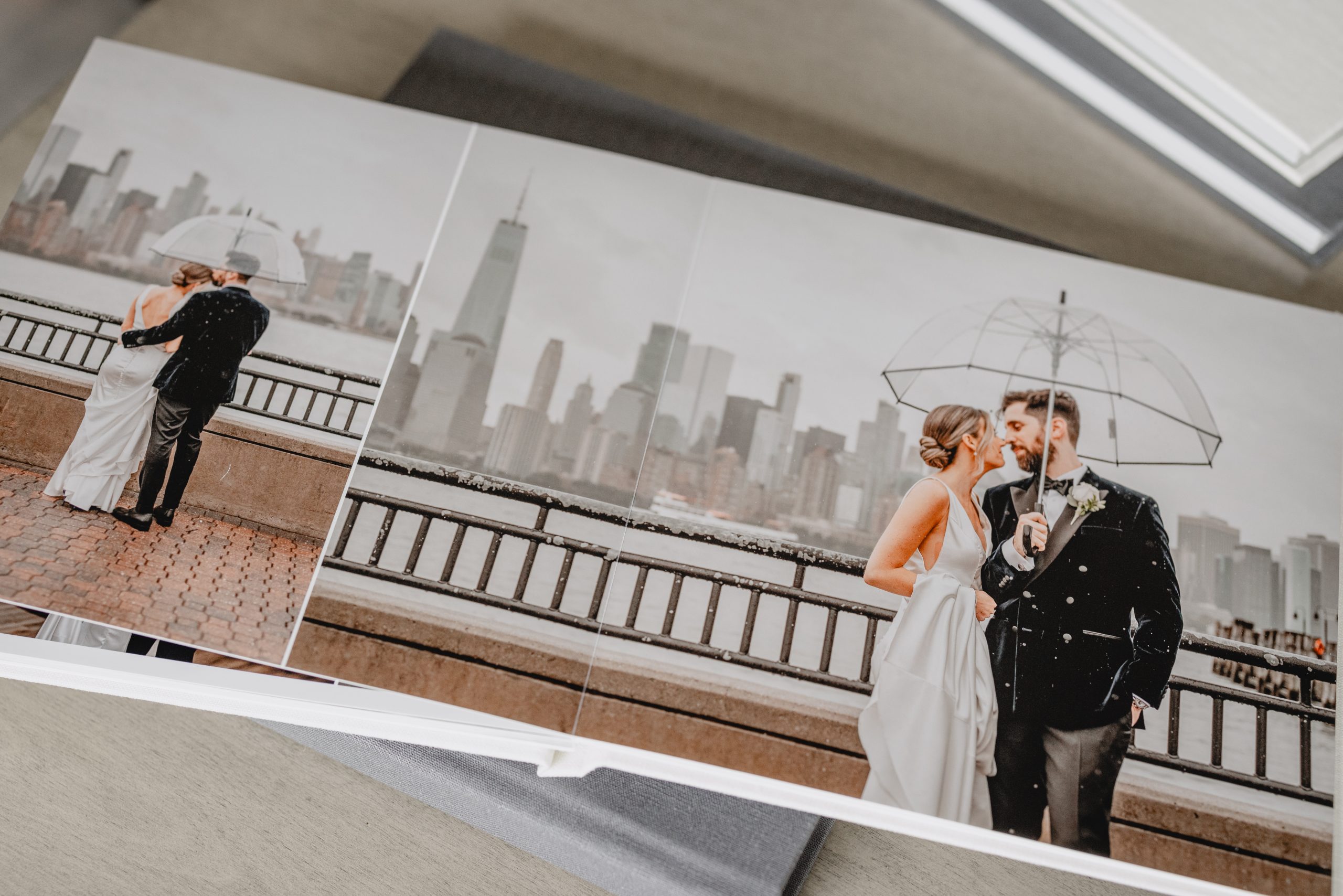 Open wedding album with romantic wedding photos, created by a New Jersey wedding photographer.