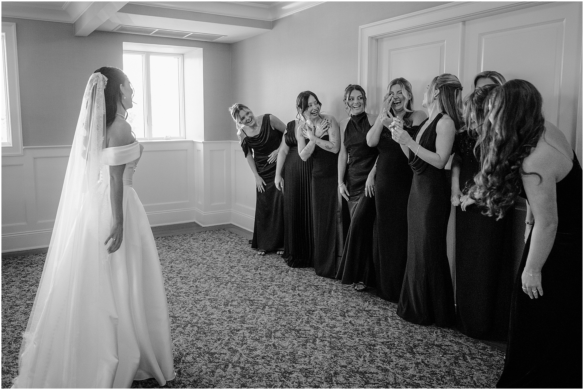 First look moment between the bride and her bridesmaids before her Tillinghouse Wedding.