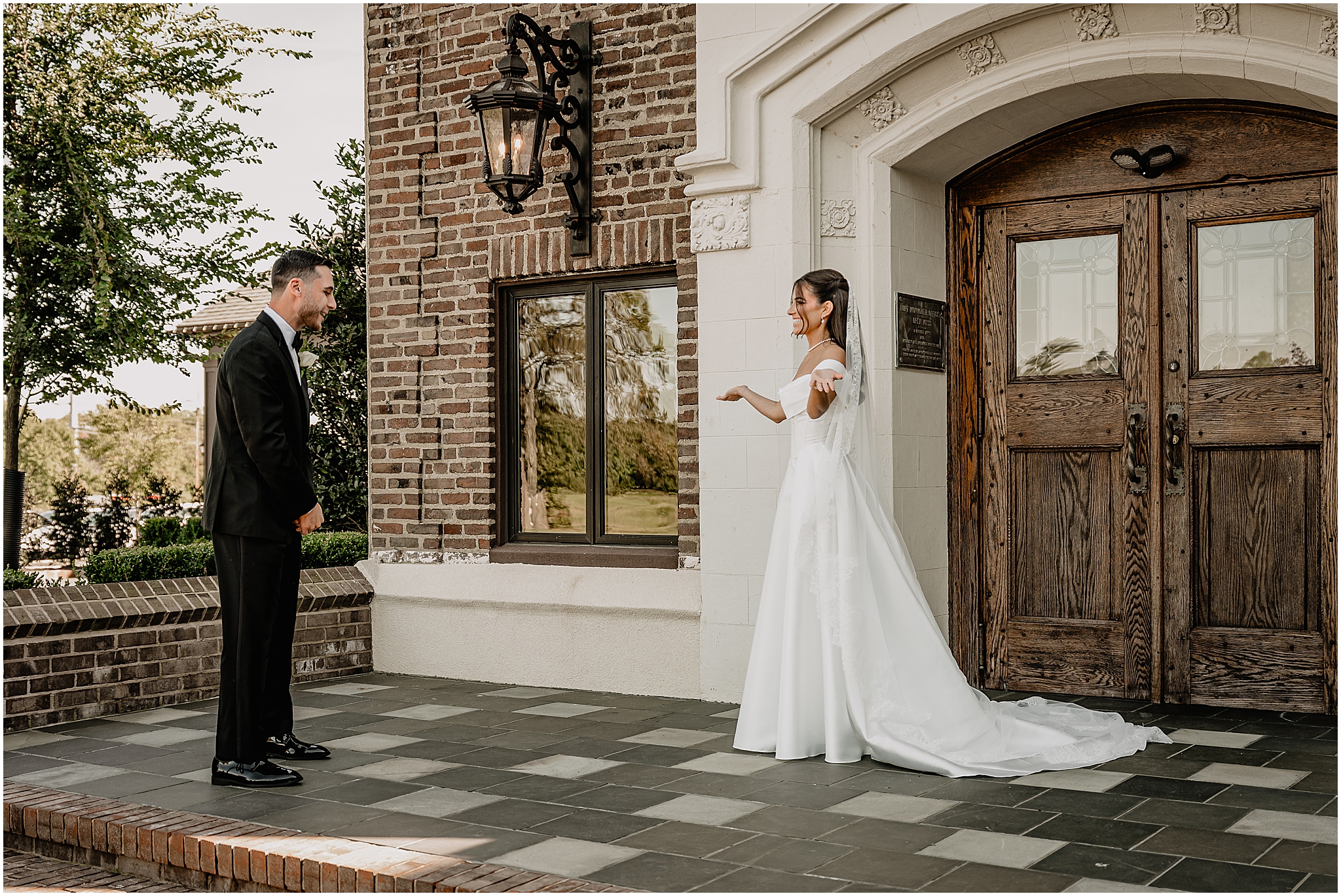 First look moment between the bride and groom outside the venue during their Tillinghouse Wedding.