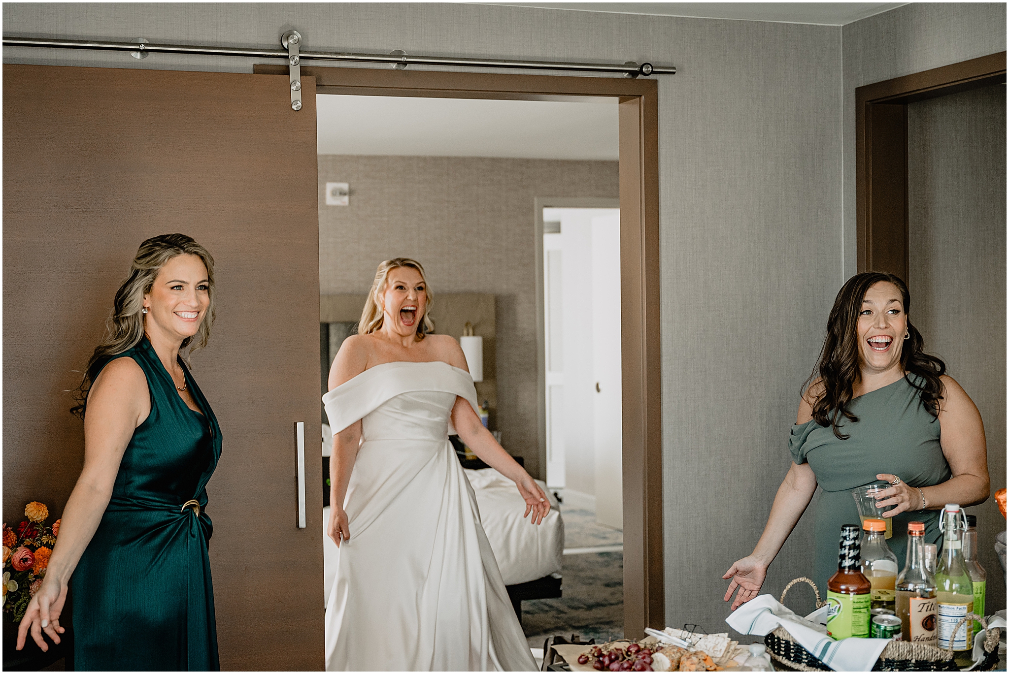 Bride’s first look with her bridesmaids, sharing an emotional and joyful moment before the ceremony at their Colorful Fall Wedding at Liberty House.