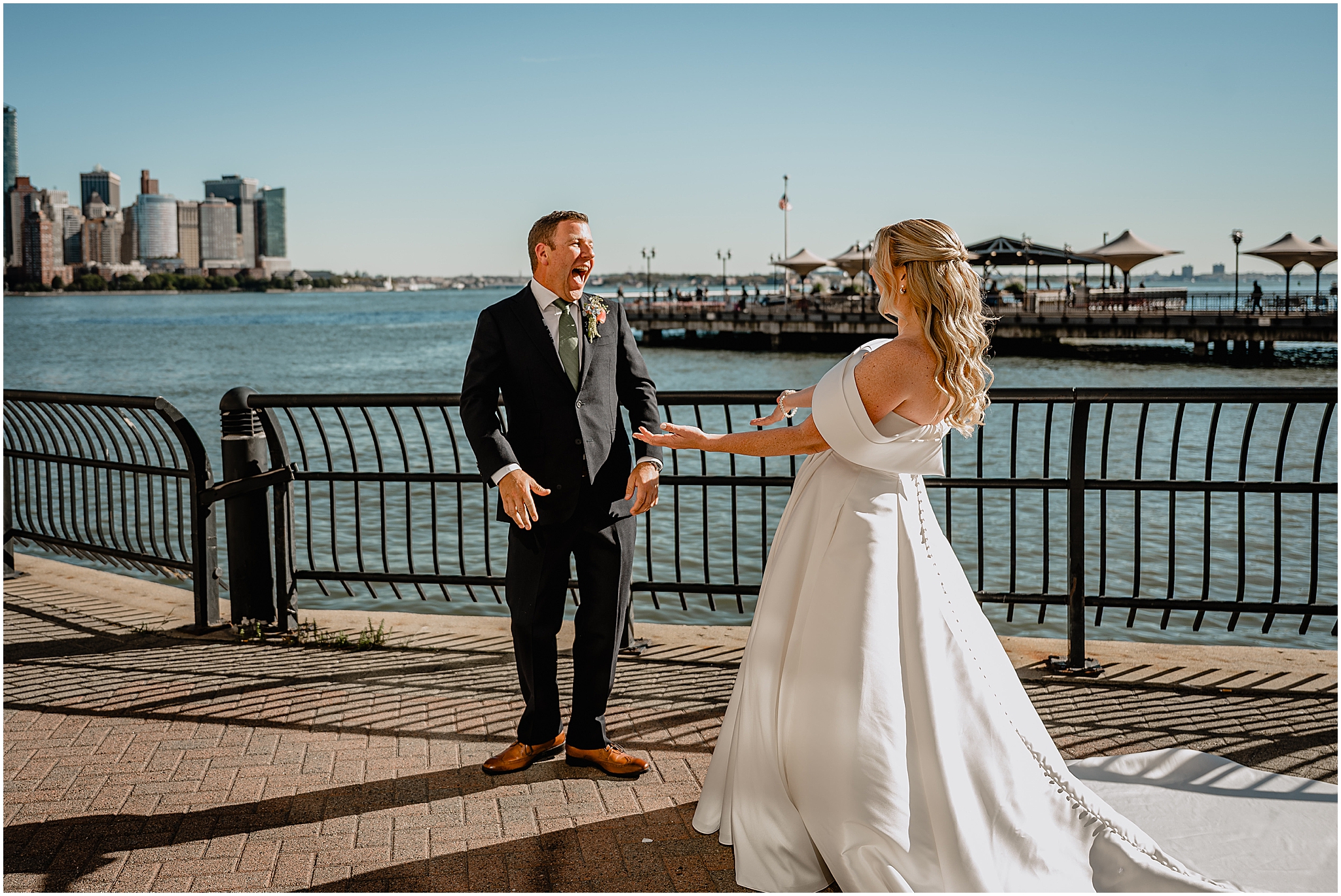 Couple's first look with the stunning NYC skyline as the backdrop at their Colorful Fall Wedding at Liberty House.