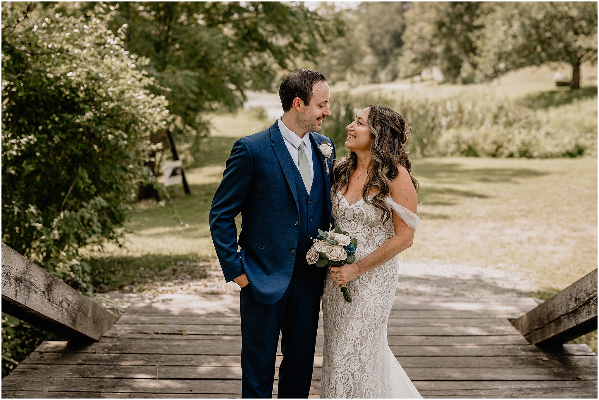 Stephanie and Ryan sharing a joyful moment during their summer wedding at Waterloo Village.