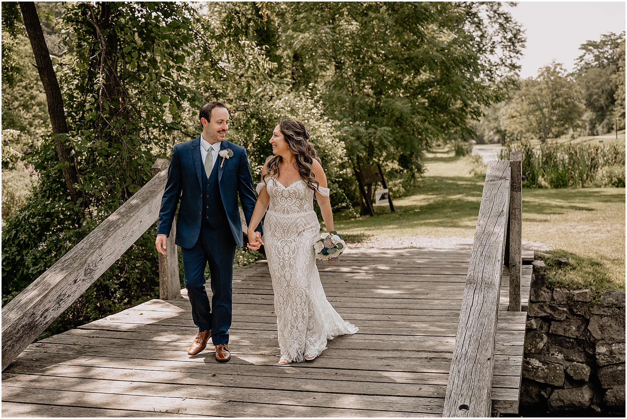 Stephanie and Ryan sharing a joyful moment during their summer wedding at Waterloo Village.