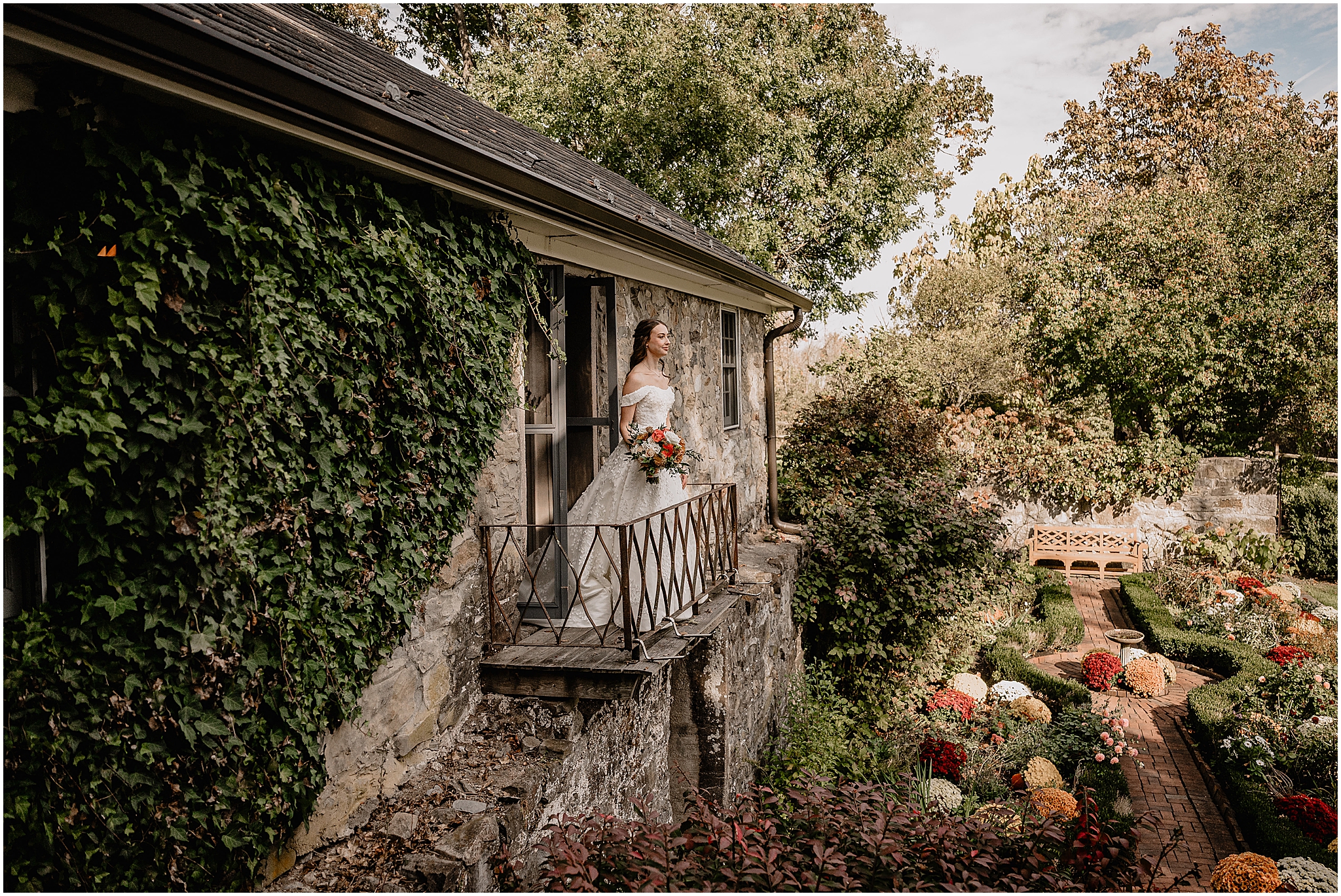 Bride standing on a balcony during her fall wedding at Crossed Keys Estate.
