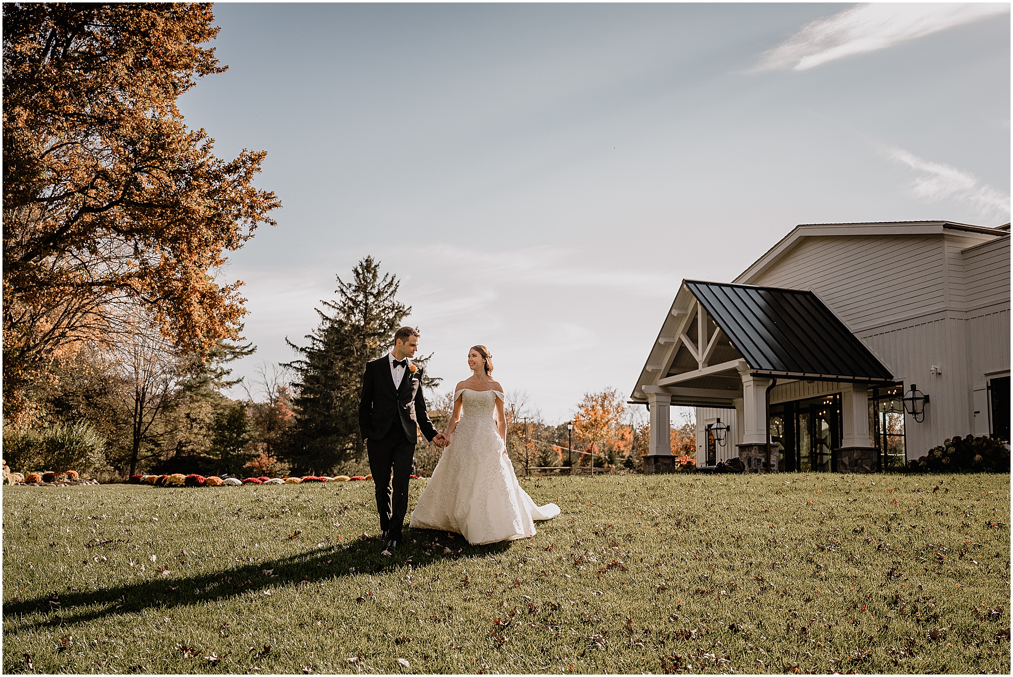 Couple portraits surrounded by autumn leaves before their fall wedding at Crossed Keys Estate.