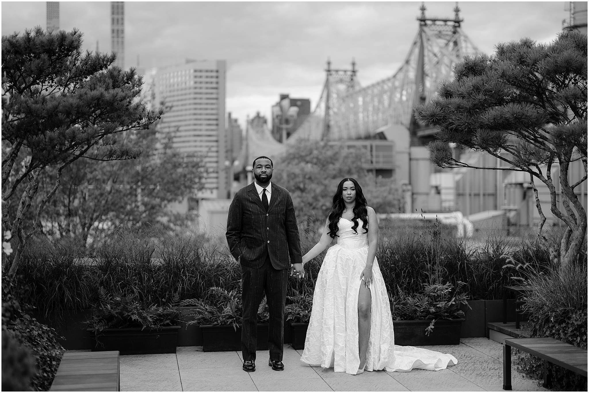 Couple portrait with the bridge in the background during their Intimate Fall Wedding at The Foundry LIC, framed by autumn colors and timeless romance.