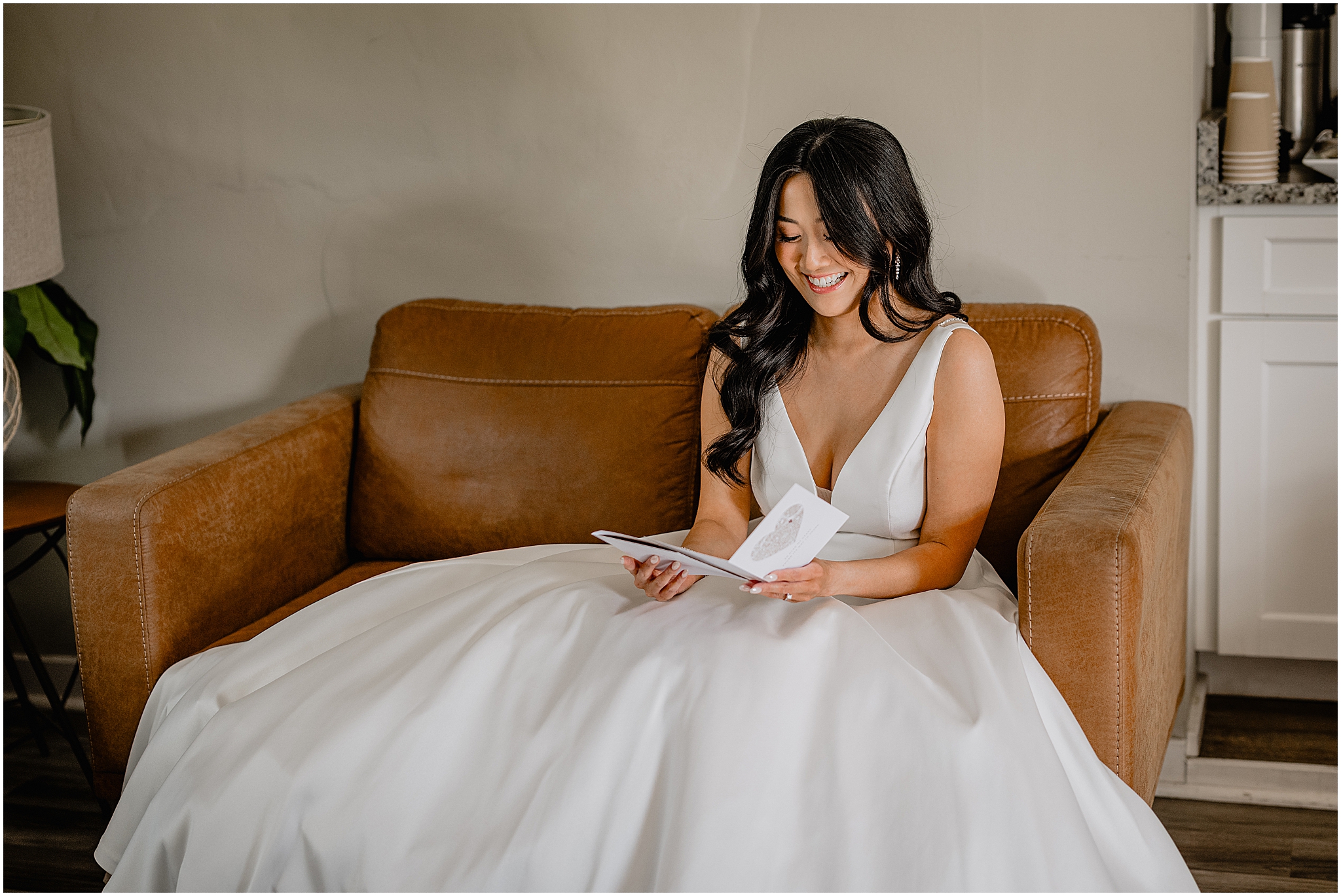 Bride reading her vows before the wedding at Perona Farms Reserve, capturing a quiet, heartfelt moment.