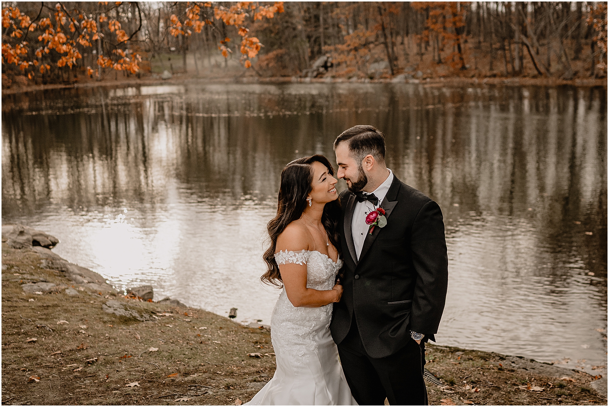 Couple’s stunning portraits by the lake before their fall wedding at Perona Farms Refinery, surrounded by soft light and autumn scenery.