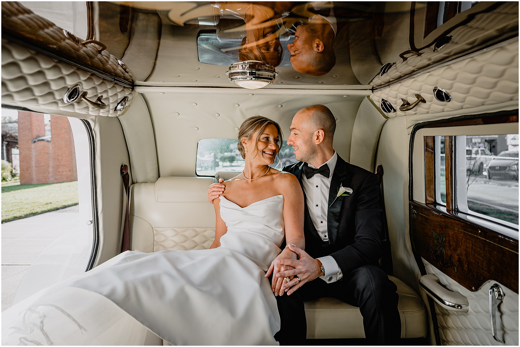 Couple inside their wedding car after their Westmount Country Club wedding.
