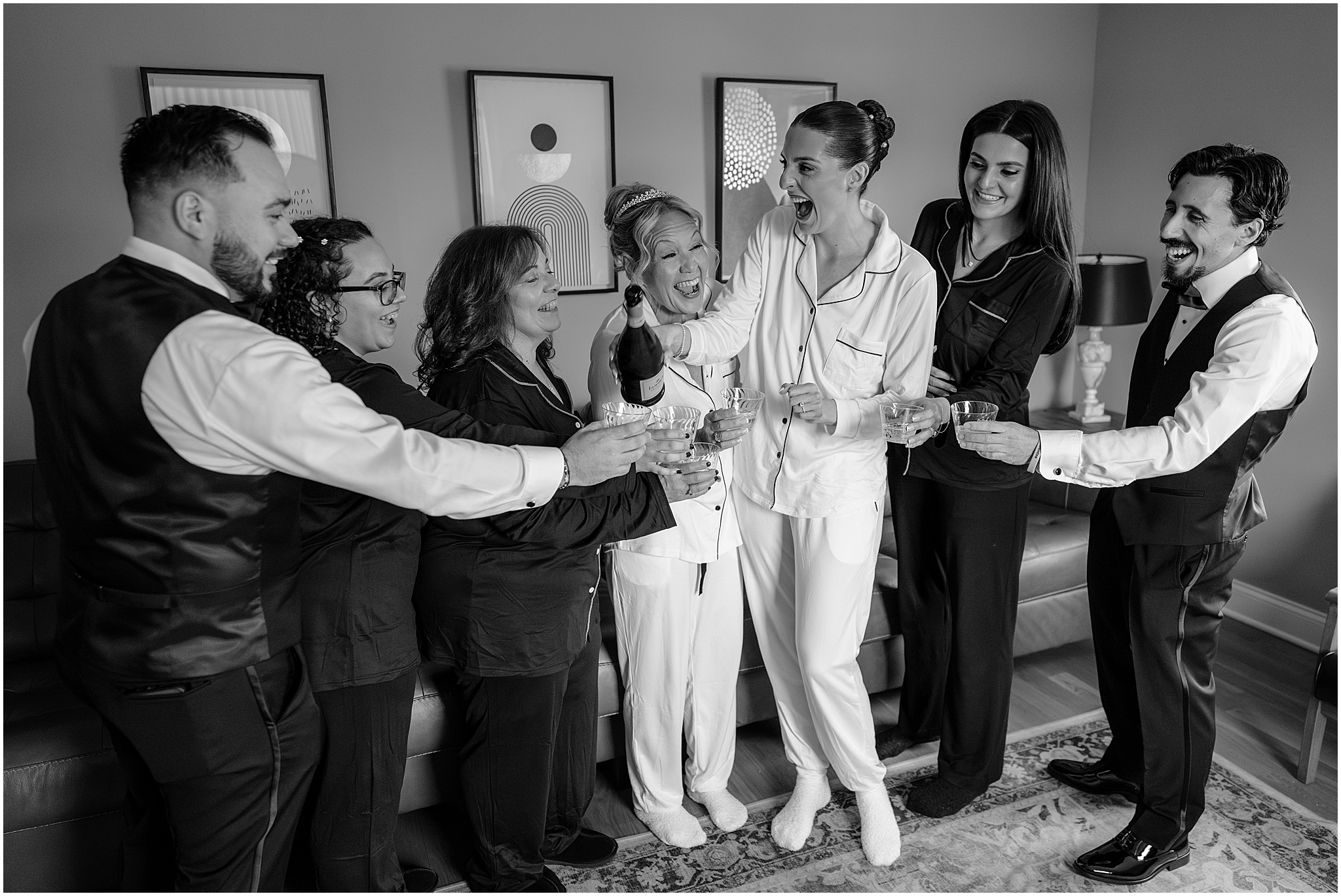 Brides with their bridal party before their winter wedding at Crossed Keys Estate.