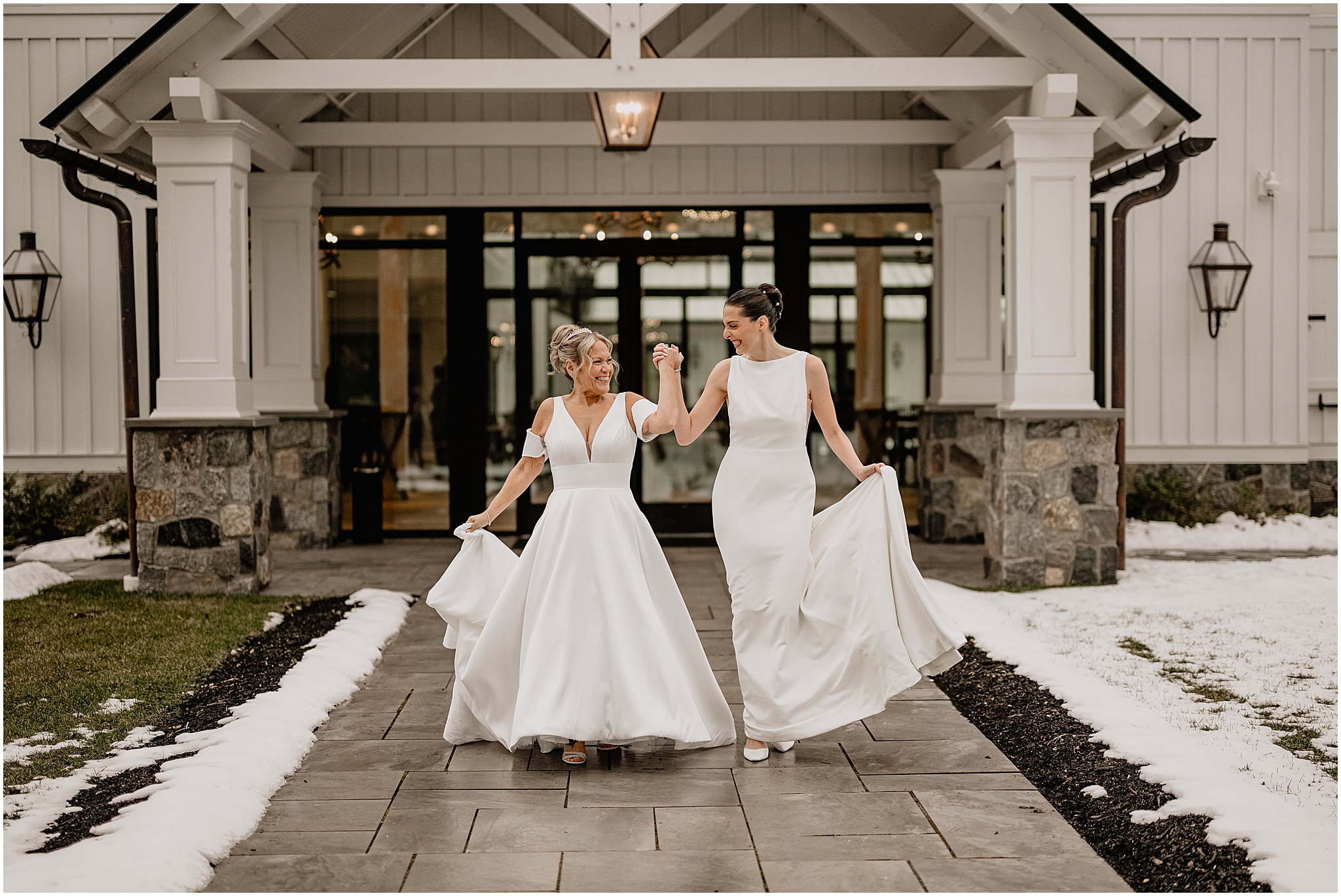 Brides holding hands before their winter wedding at Crossed Keys Estate.
