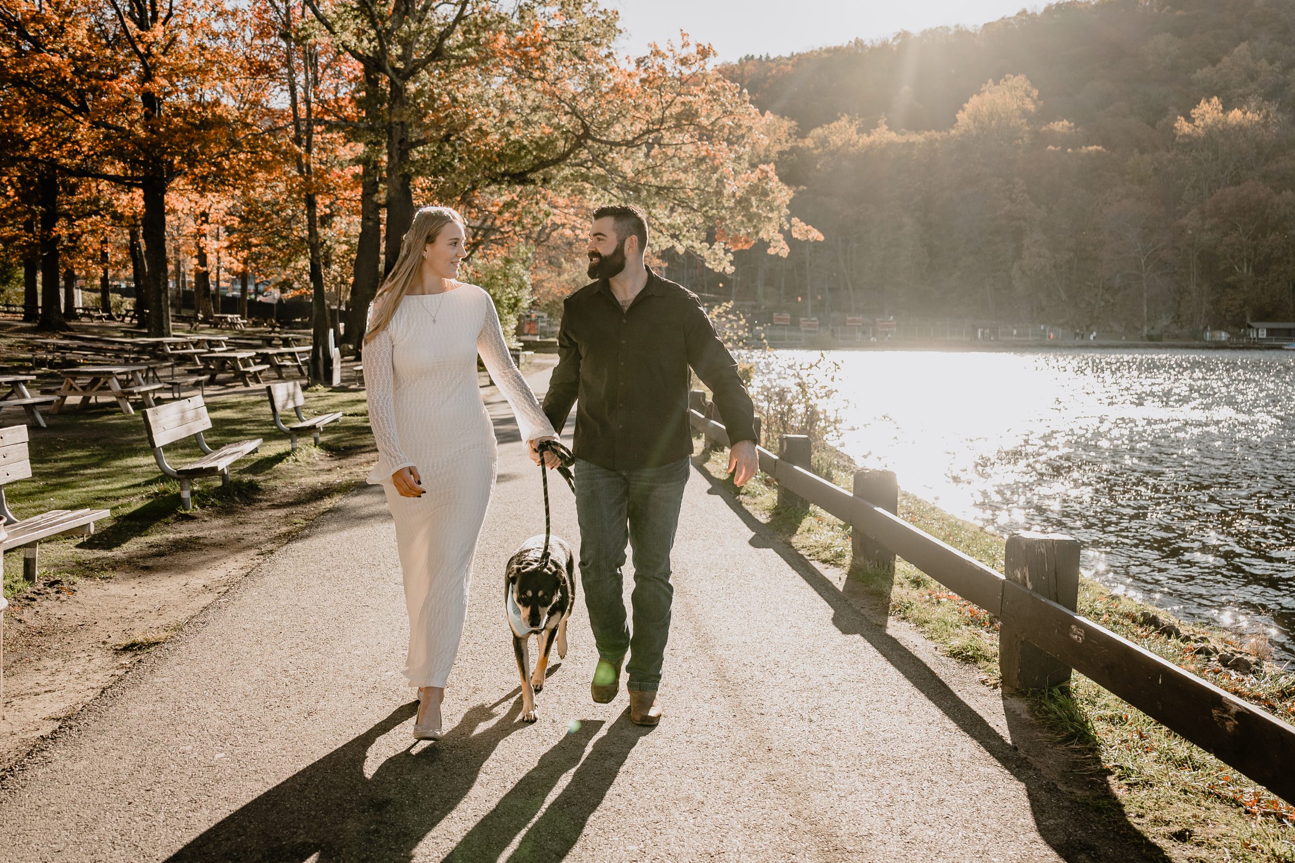 couple walking by the lake during their Engagement Session at Bear Mountain