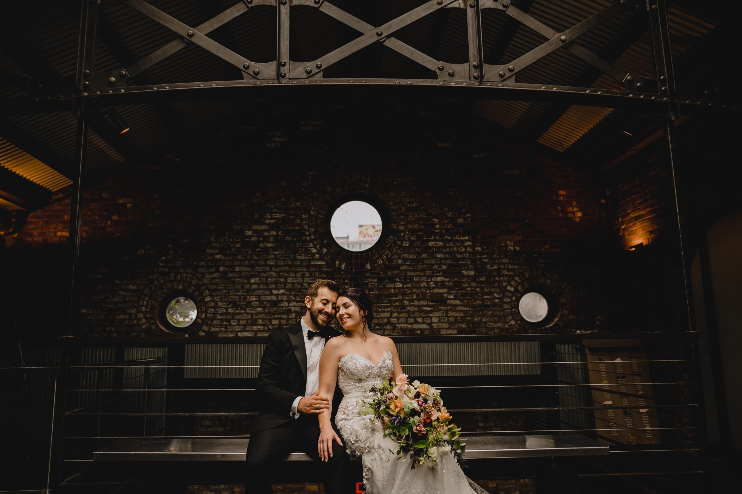 Couple sitting and Getting Married at The Foundry.