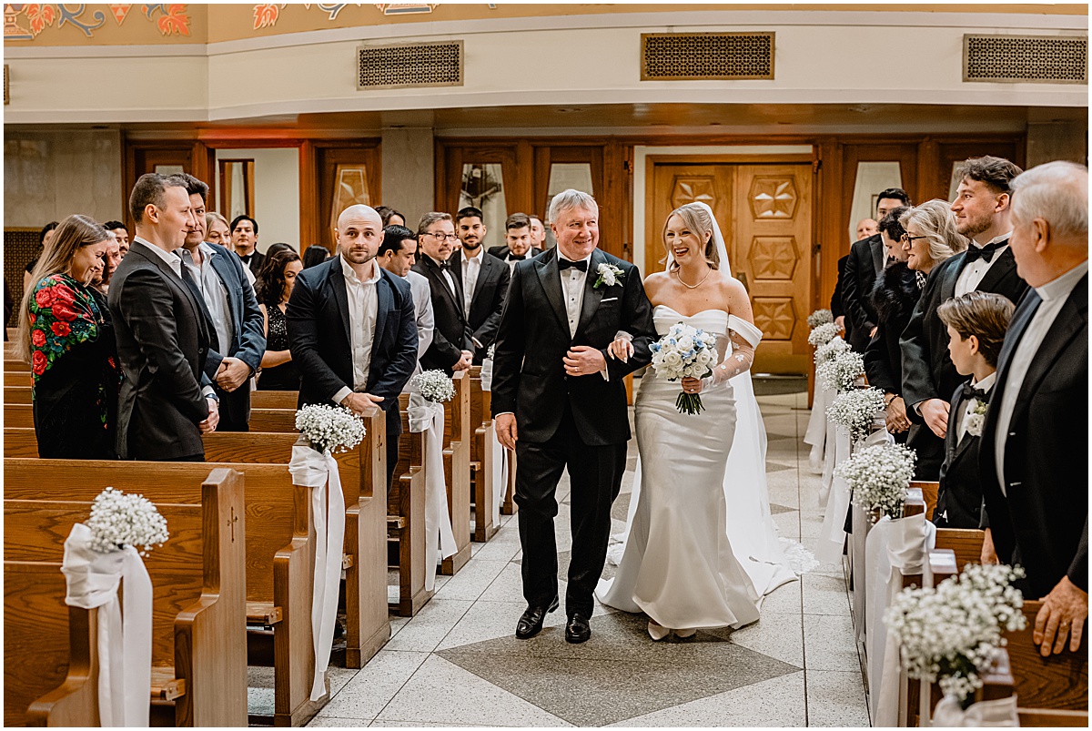 Bride walking the aisle in their Crossed Keys Estate winter wedding.