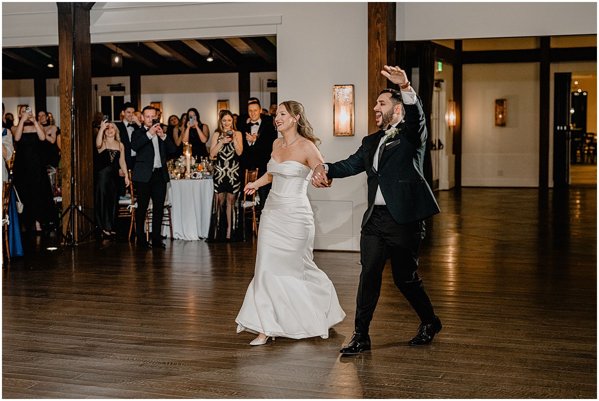 Couple's entrance in their reception during their Crossed Keys Estate winter wedding.