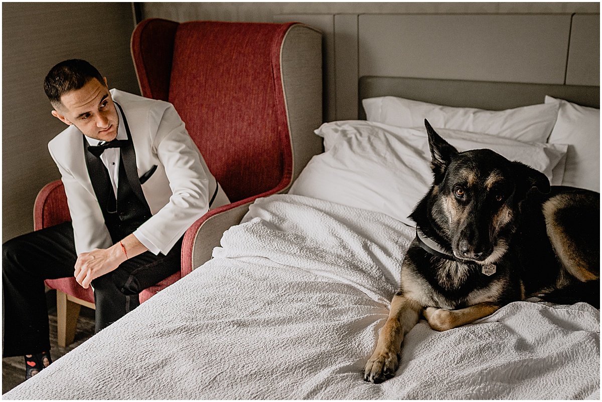Groom with his dog before his winter Hamilton Manor wedding.