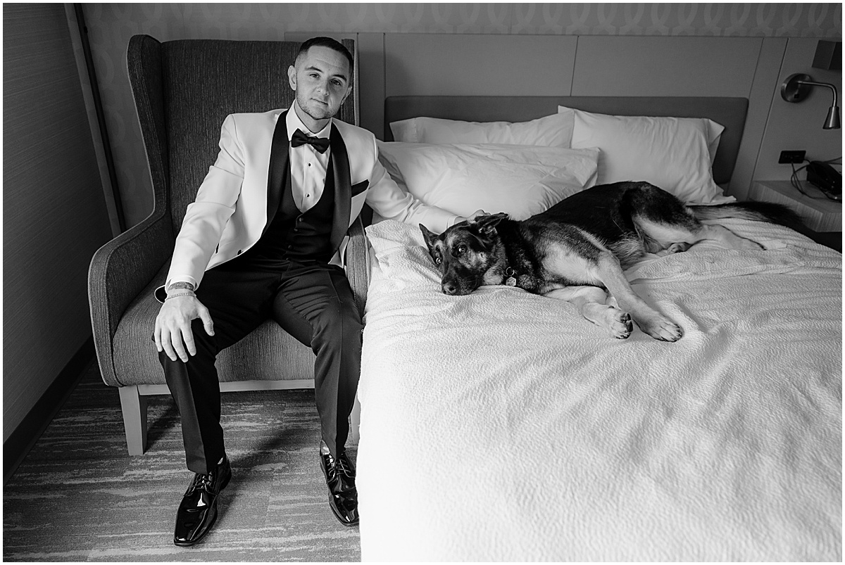 Groom with his dog before his winter Hamilton Manor wedding.