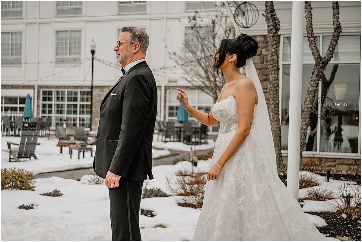 Bride's first look with her father before her winter Hamilton Manor wedding.