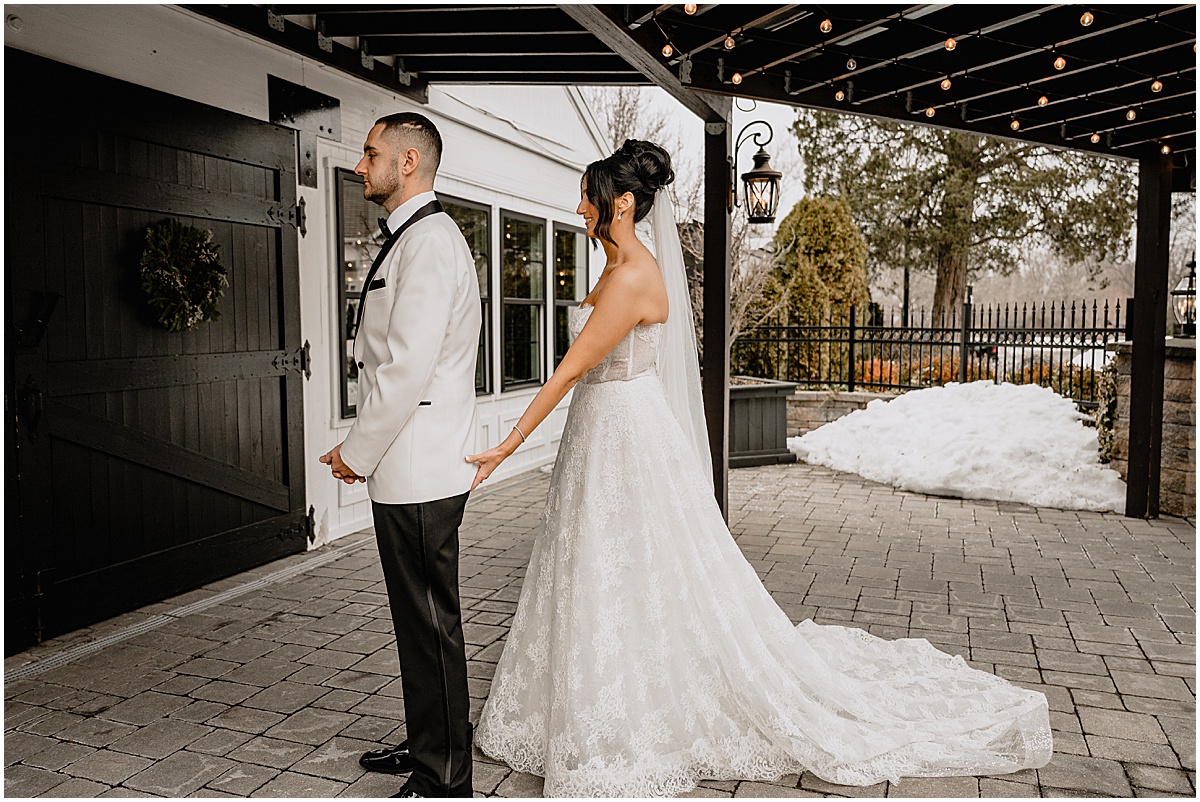 Couple's first look before their winter Hamilton Manor wedding.