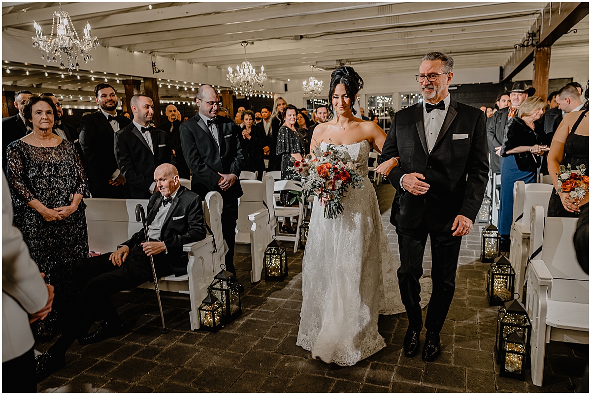 Bride walking down the aisle during their winter Hamilton Manor wedding.