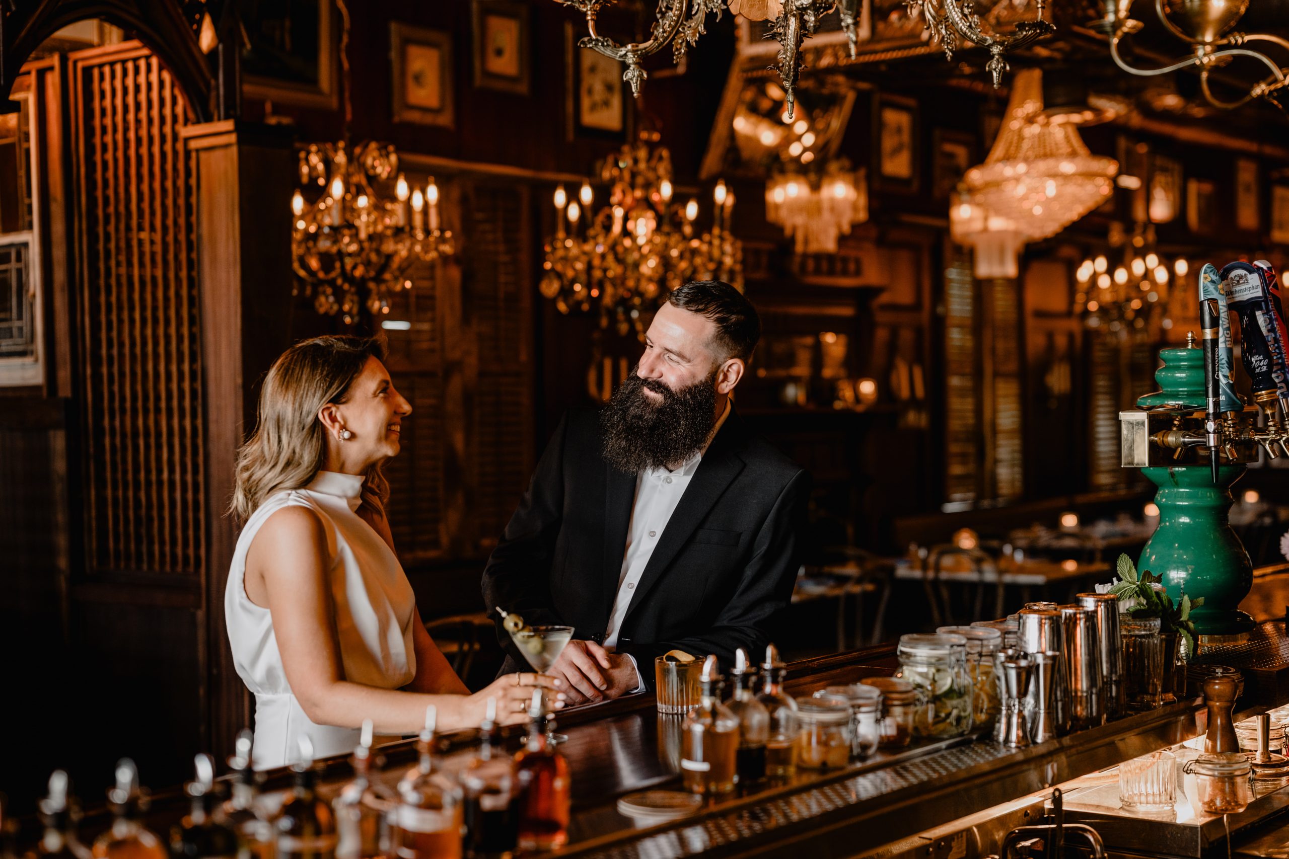 Couple by the bar at their Engagement Session at Brothers Daley Sea Bright